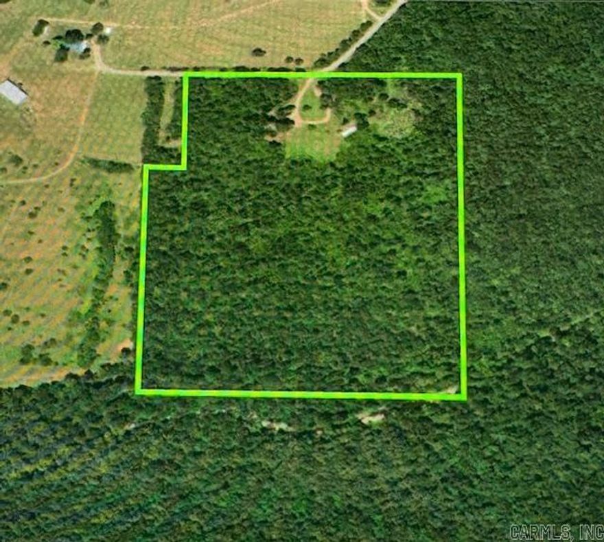 32 Acres of Prime Ozark Land - A Hunter's Paradise. Tucked away in the scenic Ozark Mountains near Locust Grove, this rare 32-acre property offers the perfect blend of wooded seclusion and open space. With approximately 28 acres of mature, marketable hardwoods and pine, this lush timberland is rich in natural beauty and teeming with wildlife - including trophy whitetail deer and wild turkey. Three serene ponds dot the landscape, creating ideal spots for wildlife watching, hunting or simply enjoying the peace and quiet. A few acres have been thoughtfully cleared, making the perfect location for a homesite, hunting cabin or weekend retreat. Plus, a septic system is already in place - one less thing to worry about!  Enjoy total privacy with no neighbors in sight, yet remain conveniently located: 20 minutes to Greers Ferry Lake and 30 minutes to the White River. Whether you're dreaming of building a cabin, establishing a hobby farm or just investing in a slice of rural paradise, this property offers endless potential. Don't miss out on this rare find! Call today to schedule your private showing and come experience the peace, privacy and beauty this land has to offer.