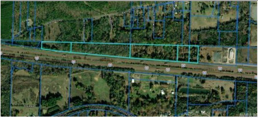 +/- 21.9 acres fronting I-40, borders commercial property in industrial park. Easement for Muskogee Rd to continue to and through property.  Can subdivide, $85,000/acre. Property is just outside Conway city limits, but is subject to territorial jurisdiction.