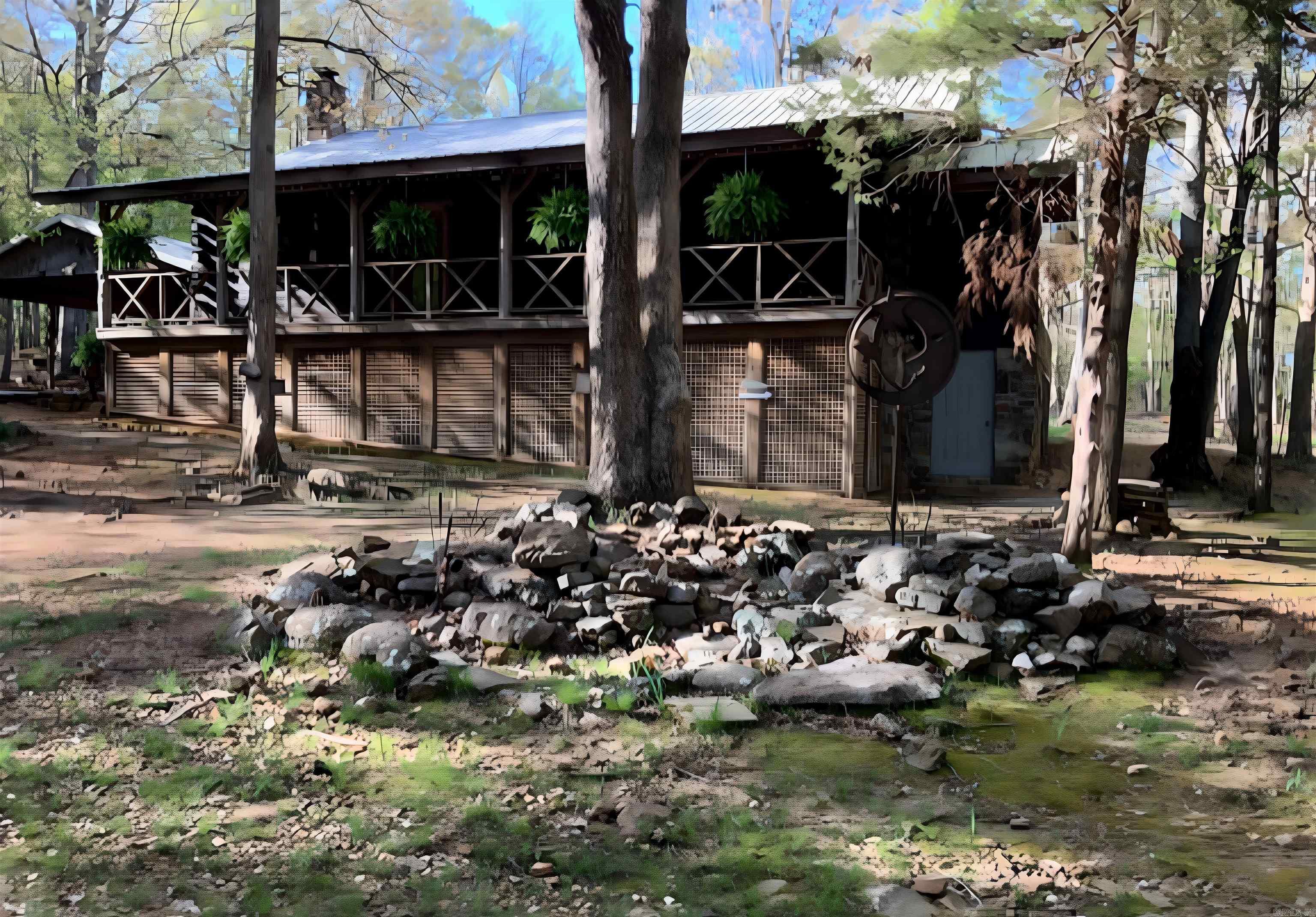 Escape to the Ozarks with this stunning 2,400 sq. ft. log cabin on 46.96 acres M/L of beautiful wooded land. Surrounded by nature, the home features a full wraparound porch and a walkout basement with a private MIL suite. Upstairs offers 2 bedrooms and 2 baths, while the basement suite includes 1 bedroom, 1 bath, and its own living space—perfect for guests or extended family. This property is full of extras, including a spacious art studio, large chicken coop, fenced garden, and multiple outbuildings. A charming 100-year-old home also sits on the land, offering restoration potential. For additional income or guest accommodations, a 600 sq. ft. guest house is located away from the main residence and currently has a renter in place. The land itself is a rare find, complete with a seasonal creek, pond, and plenty of space to roam, garden, or simply enjoy the peaceful surroundings. Whether you’re looking for a private homestead, an income-generating property, or a retreat in the woods, this one has endless possibilities.