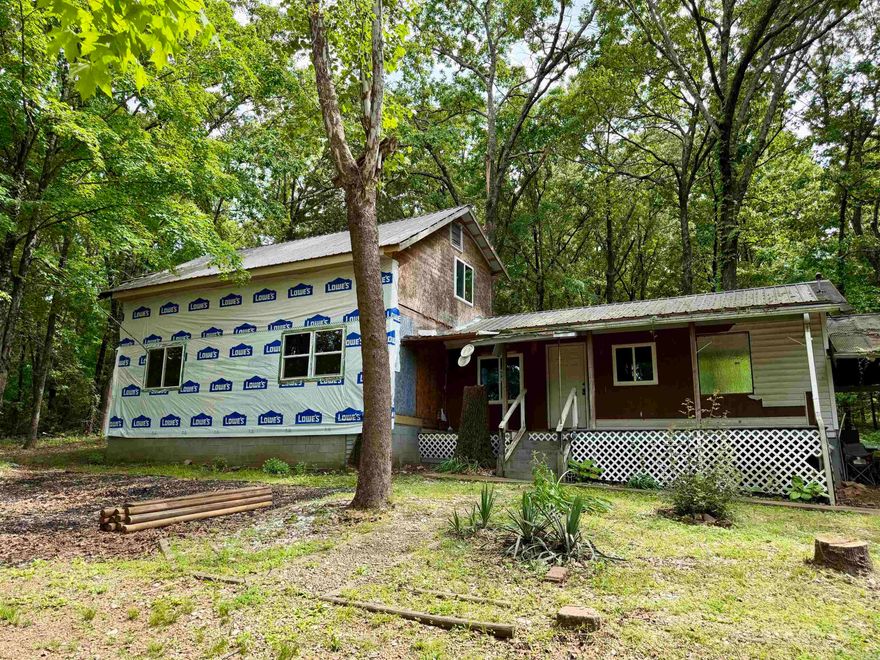 Many major improvements have already been completed including a new roof, updated interior, new windows, partial plumbing and electrical updates, plus new appliances and upper kitchen cabinets. Finish the remaining cosmetic details and siding to walk into instant equity while making the home your own. The spacious kitchen features stainless steel appliances, a butcher block breakfast bar, and pantry. Additional features include central heat and air with auxiliary gas heat, two water heaters, storage buildings, and a covered front porch perfect for enjoying the peaceful country setting near the Arkansas River. Outside you’ll find 1.78 acres with huge shade trees, plenty of room for a garden, and few nearby neighbors for added privacy.