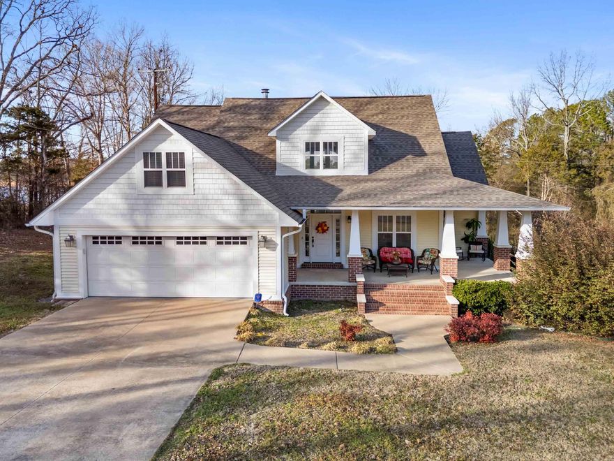 Welcome to this stunning 4-bedroom, 3.5-bath home that perfectly blends comfort, space, and scenic beauty. Designed with an open floor plan, the heart of the home features a spacious great room & vaulted ceiling, cozy wood-burning fireplace, & custom built-ins throughout—creating the perfect setting for both everyday living & entertaining. The fully equipped kitchen is a dream, complete with a large island, ice maker, & ample space for gathering, all flowing seamlessly into a separate dining room for more formal occasions. Gorgeous wood floors run throughout the home, adding warmth & elegance at every turn. The primary suite on the main level offers a true retreat with generous space, a luxurious bath featuring a jetted tub, walk-in shower, & walk-in closet. Additional upstairs bedrooms provide comfort & flexibility for family or guests. Upstairs, the bonus room is ideal as a playroom, hobby space, or even a 5th bedroom. Step outside to enjoy composite decking & relax while taking in beautiful views of Greers Ferry Lake. Located at the end of a quiet cul-de-sac and just minutes from Sandy Beach and local schools, this fully FURNISHED home is move-in ready for both full-time living.