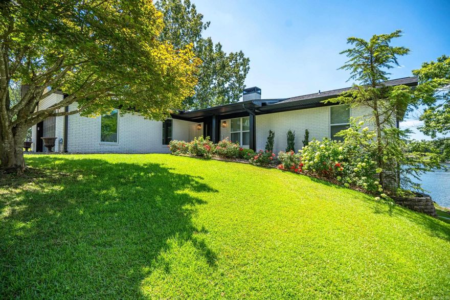 Gorgeous lake home with all the luxury upgrades! Breathtaking lake views greet you from the moment you walk thru the door. Light neutral tones through out with little pops of color add to the beauty of this large family home. Enjoy breakfast on the upper deck overlooking the pool, spend your day boating or relax poolside on the lower patio til the sun turns into the stars. Custom cabinetry, granite counters and one of a kind features give this home its one of a kind charm. Perfect for entertaining with 2 living areas both with feature fireplaces. Make this your new home and let the summer sun set on your happily ever after! Fully furnished except the green chairs downstairs do not convey.