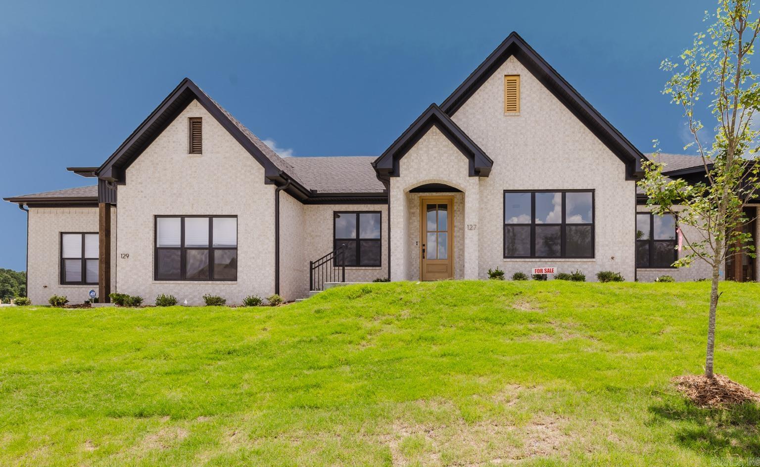 Welcome home to West Little Rock's latest destination for luxury living, Edgewood! Surrounded by lush landscaping and mature trees, the Edgewood community provides a secluded atmosphere while being just moments away from your favorite shopping and dining spots in West Little Rock. Another perk of this desirable neighborhood? NEVER MOW YOUR LAWN AGAIN! Lawn maintenance is included with your yearly fees! This unit has 2 bedrooms, 2 full bathrooms. Fully loaded chef's kitchen includes walk-in pantry, central island and opens to spacious living room with built in fireplace. Master Suite includes high vaulted ceilings and the spa like bathroom which has a walk-in shower with walk-in closet. Laundry Room, Two Car Garage and covered back patio accessed off the private drive. Get in now to customize interior selections~ (Tile, paint, lighting, flooring, etc) This unit is under construction. The photos are a replicate of the layout but the exterior/interior colors will be different. ETA completion December.