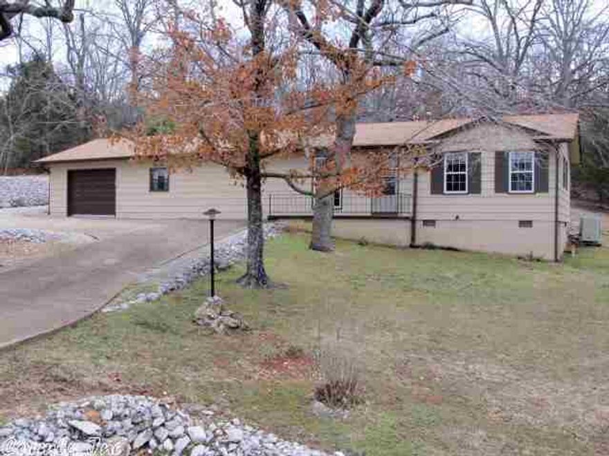 As Neat As It Looks!  You won't be disappointed when you look at this 2 bedroom home.  Large living room with wood burning stove overlooks a landscaped back yard.  The concrete patio blends into a garden area in this peaceful setting.  The garage has plenty of room for an auto and an adjoining workshop with benches and a "pot bellied" stove.  The interior is just as well kept as the outside with ornate woodwork trim, nice sized bedrooms and an efficient kitchen.  A great home at a great price.