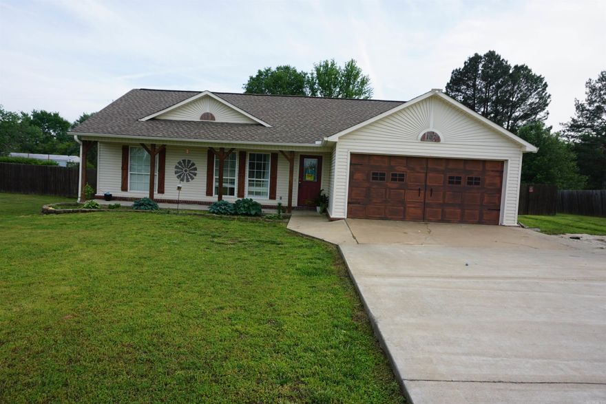 Very nice house in a great location just 2 minutes off the exit in Judsonia and only 10 minutes from Searcy. House is updated and has no carpet. Laminate and tile floors throughout. Split floor plan with open living room and kitchen dining room combo. Kitchen has tons of updated cabinets and a nice pantry for more storage. Stainless refrigerator with bottom freezer will stay. Both bedrooms have nice closets and the primary bedroom has a walk in closet and a nice full bathroom. Main bathroom has a tub shower unit.  There is a Family Safe installed in the garage and bolted to the floor and also a workbench. The water heater was replaced and is in the storage room in the garage.  The back yard is huge and has a large covered back patio. There is a large metal carport with a concrete pad in the privacy fenced back yard. Roof was put on in 2021. The front porch is super cute and has cedar posts and cedar shutters.