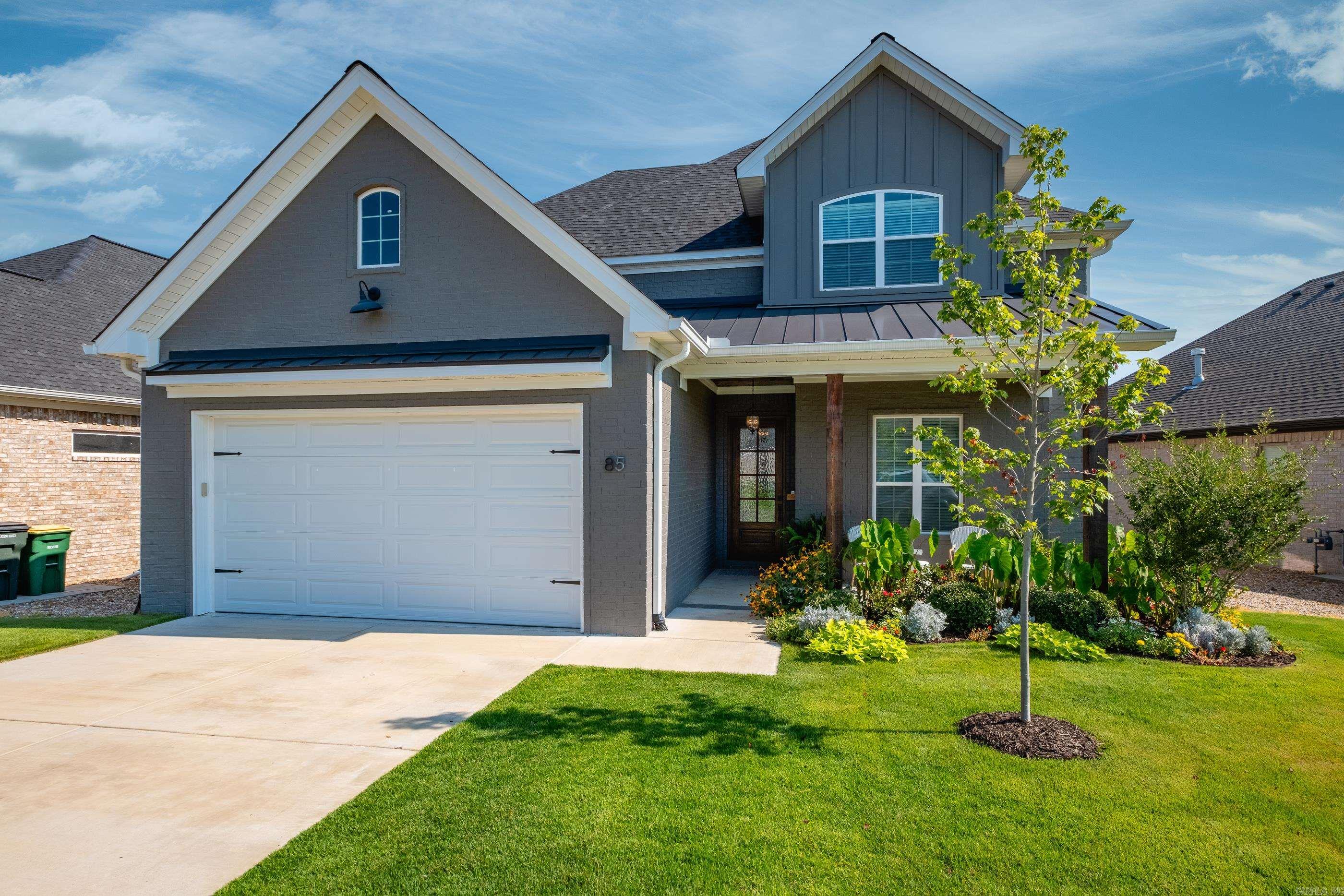 This newly built residence offers a perfect blend of modern elegance and practical living. Featuring 4 spacious bedrooms and 3.5 bathrooms, this home is designed with both comfort and style in mind. You are welcomed by a bright and airy open floor plan that effortlessly blends style and functionality. The heart of the home is the stunning chef's kitchen, featuring an oversized island, a dry bar with beverage fridge, tile backsplash, stainless steel appliances, gas cooktop, microwave, wall oven and refrigerator. Enjoy the convenience of ceiling-height cabinets, along with a generously sized walk-in pantry to accommodate all your culinary essentials. A drop zone is located off the garage, complete with custom built-in cubbies. The primary suite is on the main level and offers a spa-like bathroom featuring a frameless glass shower, relaxing soaking tub, double vanities & private water closet. The expansive primary closet is enhanced by custom built-ins and offers direct access to the laundry room. Upstairs you will find 3 generously sized bedrooms and 2 well-appointed bathrooms. Step outside to find a beautiful covered patio and fully fenced backyard that is perfect for entertaining.