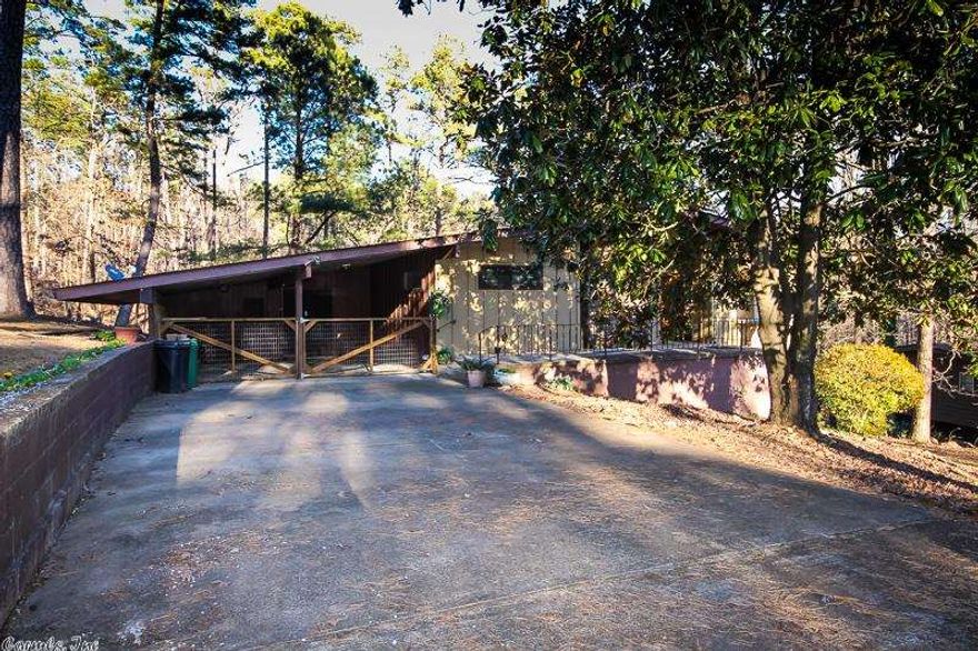 READY AND WAITING FOR YOU. SPLIT BEDROOM FLOOR PLAN WITH LARGE VALUTED GREAT ROOM, ROOMY KITCHEN WITH OODLES OF COUNTER SPACE. SPACIOUS ARKANSAS ROOM WITH WET BAR AND ADDITIONAL STORAGE ALL WRAPPED AROUND WITH A NEWLY ENLARGED DECK. BATHROOMS UPDATED, FLOORING UPDATED, INTERIOR PAINT UPDATED, KITCHEN APPLIANCES UPDATED......NOTHING LEFT FOR YOU TO DO EXCEPT RELAX BY THE NATIVE STONE FIREPLACE AND ENJOY.DOUBLE CARPORT. COME BY AND CHECK THIS BEAUTY OUT. YOU'LL APPRECIATE THE WORK ALREADY  DONE FOR YOU.