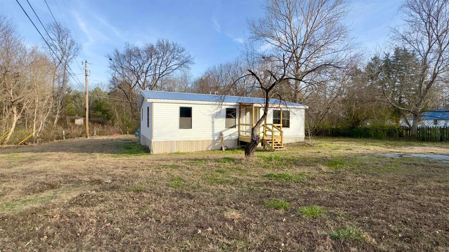 This two bedroom, two bathroom mobile home sits on a spacious corner lot in Izard County, offering rural Arkansas living with room to enjoy the outdoors. Located in the heart of Pineville, Arkansas, this property provides small-town living while remaining a short drive to schools, shopping, and amenities in nearby Calico Rock, Arkansas.  With 1,080 sq. ft. of living space, this property has been updated with a new roof and new flooring throughout, making it move-in ready. Outdoor enthusiasts will appreciate the close proximity to the White River and Norfork Lake, both known for excellent fishing, boating, and recreation. Whether you’re searching for an affordable home or a weekend getaway near lake and river access, this property delivers comfort, location, and value in the Ozark Mountains of North Central Arkansas. Priced to sell for $69,000.
