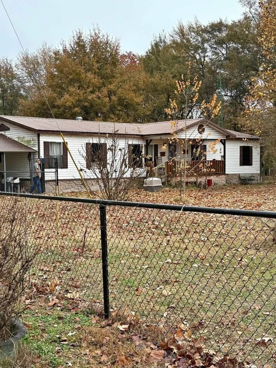 Outbuildings, Porch Screened, Fencing: Chain Link, Storm Shelter, Front & Back Porch, Wood Burning Stove