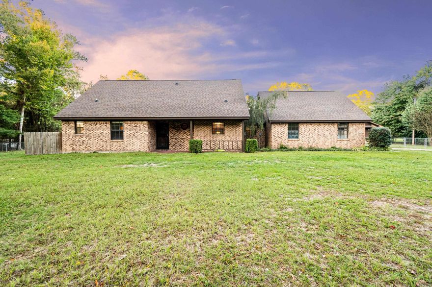 This charming two-story brick property offers three bedrooms and two baths with plenty of character and a functional layout. Step in from the two-car carport into a spacious laundry room that doubles as the perfect mudroom—ideal for keeping dirt and clutter out of the main living space. The interior features new carpet, fresh paint, and several updates throughout, including a new roof in 2025. Kitchen has stone countertops and a small breakfast bar for extra seating. Don't miss the pantry! Enjoy the large, fenced backyard complete with a great shop and a whole-home generator for added convenience and peace of mind. Situated on just over an acre at the end of a quiet dead-end road, this property offers a blend of privacy and neighborhood appeal—all just minutes from town.