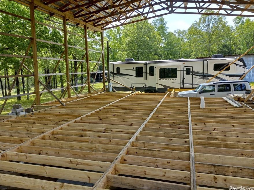 Live and hunt on your own property. Sellers started the construction of a 40x60 House and also has a 20x30 Tractor Shed and a 20x30 Shop plus a storm shelter and then their plans changed. Pick up where they left off and continue on or modify to suit your needs. Property already has the electric ran, and there is a well with a new pump and tank. Well pump goes 60' deep. Sellers have had their RV hooked up to the septic and the well during construction. There is a 20' easement about 1/4 mile long recorded easement from Jackson 6 to this property. There is about 15 acres of virgin timber with red oak and white oak on it. There is a wet weather pond and 2 creeks on the property. Multiple deer stands will convey and there are several atv trails. ***There are cameras up so please make an apt. before going*** Also, Sellers are selling their 2021 Keystone Montana Fifth Wheel RV that they have had connected on this property. More info & pics available if needed.   Agents please see agent remarks for showing info !