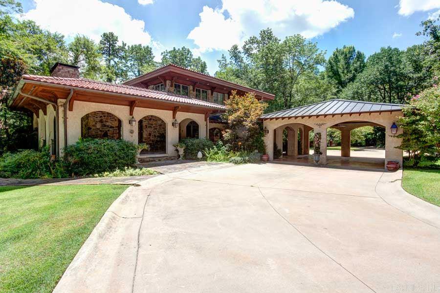 TUSCAN RETREAT IN THE HEART OF THE HEIGHTS ON 14 ACRES! GATED COMPOUND - TOTALLY REMODELED MAIN HOUSE HAS 4315 SQUARE FEET WITH NATURAL STONE FLOORING THROUGHOUT. WONDERFUL KITCHEN WITH EVERY AMENITY INCLUDING A NEW SONIC ICEMAKER! MASTER SUITE ON MAIN LEVEL WITH SPA BATHROOM. NEWER GUEST HOUSE (1,074 S.F.) OVER 3 CAR GARAGE, PROFESSIONAL WORKSHOP (2,399 S.F.) WITH FULL BATH. LITTLE ROCK NATIVES WILL REMEMBER THIS AS THE OLD ROCKCRUSHER LOCATION. VERY SPECIAL PROPERTY!