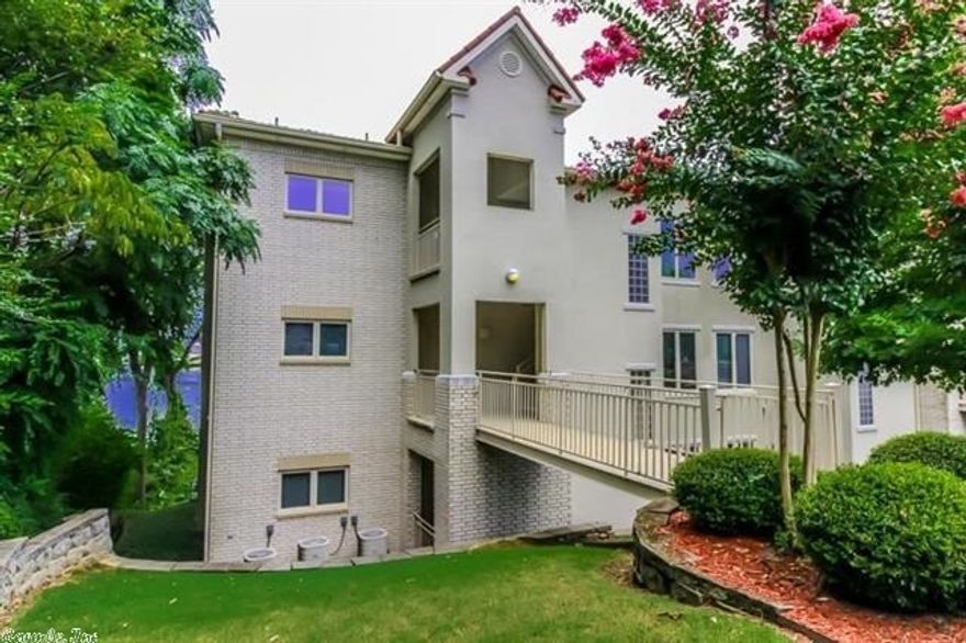 With a view that is incomparable, this 1756 square foot unit is a piece of luxury on Lake Hamilton. Enjoy minimum maintenance and maximum pleasure when you call this spacious two bedroom, two bath condo "home!" From your hillside vantage point you can enjoy panoramic views of Lake Hamilton and the mountains beyond. Watch the Belle dock as you sit on your covered deck and enjoy life! Inside the open concept living area is spacious for entertaining, yet comfortable and cozy for relaxing.