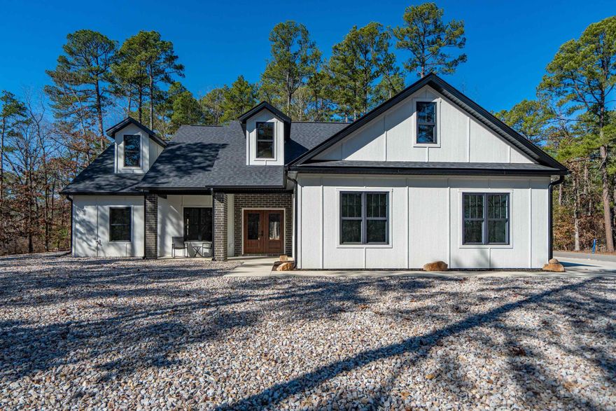 * Do you want a LEVEL lot/yard in HSV?* Look no farther. This new construction custom built home has everything... & more. No detail was over looked. Centrally located in HSV you are almost equal distance from the Hwy 7N and Hwy 5 gates. Giving easy access to Hot Springs or Benton. This home is situated on a corner lot with 3/2/1 on the main level and bonus room upstairs that could serve as an additional bedroom, exercise space, office, play room or just storage. The main living space offers an open concept with 9 ft vaulted ceilings. The kitchen is a chef's dream w/ Cambria Quartz countertops, Kraftmaid cabinets, 4x8 ft island w/prep sink, & pop up receptacles for appliances, & USB charging. The bedrooms offer a split floorplan for privacy. The bathroom mirrors have LED lighting & anti-fog technology. The laundry room has a new washer/dryer combo & half bath. Making it an ideal spot to drop muddy shoes from the garage or for upstairs. The 3 car garage is oversized (approx 765 sq ft) w/ smart technology. Auto door openers w/ built in cameras and 2 way audio through your smart phone. Exterior is smart siding with black trimmed Quaker windows. Come enjoy HSV!