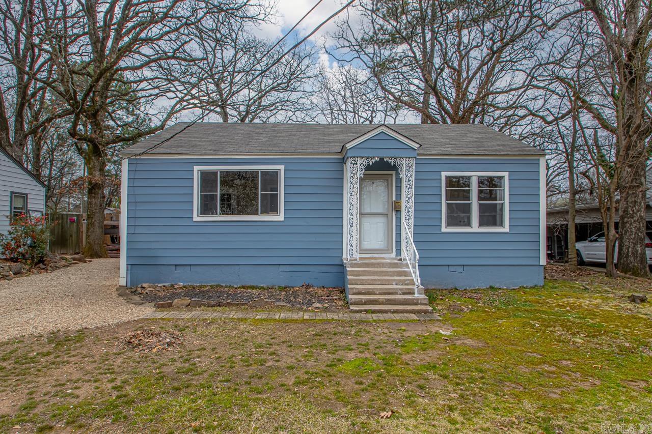 WOW! What a cutie! All redone! Top to bottom! Roof! Floors throughout!! Subfloors!Paint~ inside and out! Kitchen - Cabinets! Appliances! New! New New! Bathroom updated and sitting pretty! Come see today! Lots of work has been done to get it ready just for you!! Back yard is huge! Fun rock out door grill! flower beds! I bet you will love it! Laundry room inside! New Heat and Air! WOW! parking pad with new gravel!