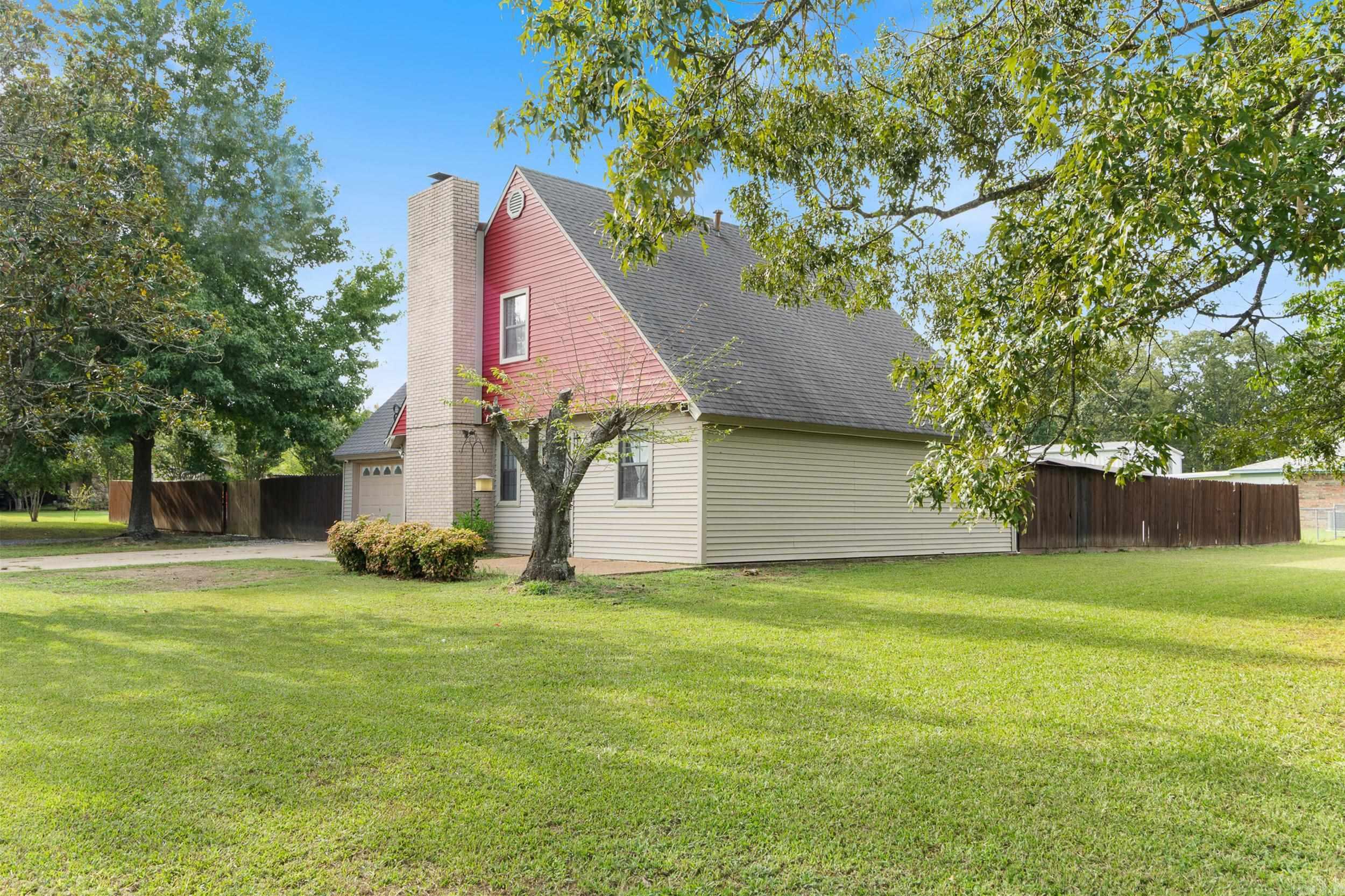 Welcome to this spacious 4-bedroom, 2-bath traditional home on a corner lot in Westwood Subdivision. With nearly 1,820 square feet on 0.49 acres, this property blends comfort and function. Inside features include a split-bedroom layout, separate dining room, laundry area, and built-ins. The kitchen offers a built-in stove and gas range. Flooring includes vinyl, tile, and luxury vinyl for durability. Outside, enjoy a deck, fully fenced yard, storm cellar, and outside storage. The home also provides a two-car garage, central electric cooling, central gas heating, and municipal utilities.