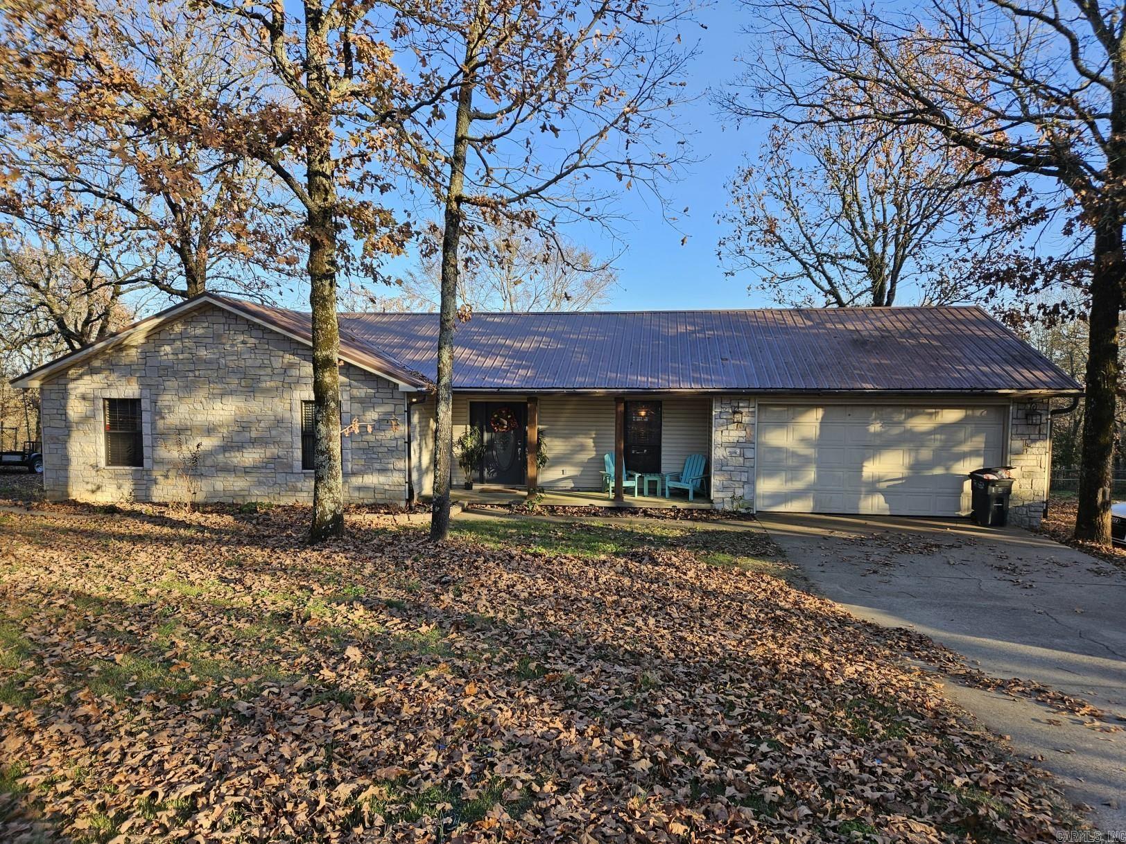 Home in the country on 1.15 acres with plenty of charm. Cozy living room with gas fireplace along with spacious master bedroom and master bath with jetted tub, separate shower and double vanities. Improvements throughout the home within last two years consist of new vanity and light fixture in hall bath, granite countertops and new stainless sink in kitchen, updated painted cabinets, new appliances, ceiling fans and hot water heater. Heat and air replaced approx 6 years ago. Covered backyard deck and exterior door new Summer of this year. Sod and updated landscaping to front yard and newly fenced backyard (property extends down the hill beyond fence). PLUS 2-car garage. Several household furnishings negotiable with sale. This is an absolute must see!