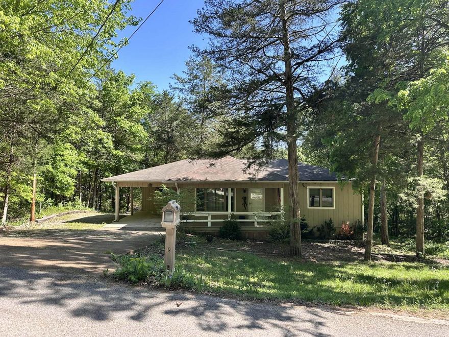 This Riverfront 2-bed/2-bath home features a bonus room great for a home office, nursery, reading nook, or anything your lifestyle calls for. The primary suite includes a spacious walk-in closet and relaxing bathroom with a soaking tub, separate shower, and double vanity sink. The kitchen is designed for comfort and efficiency with granite countertops, stainless steel appliances and an easy-to-work-in layout. The laundry room provides additional pantry space. The kitchen opens to the living/dining area through a convenient pass-through, creating a natural flow for everyday living. Step out onto the back deck—accessible from kitchen and primary bedroom—and enjoy your morning coffee or unwind with an evening beverage. Additional storage is available beneath the deck and in the walk-in basement. New paint, floors & water heater! Casement windows.  Follow your private path to the river, passing occasional local wildlife and beautiful native flora. Set up a seating area at the water’s edge and take in the rolling hills and gentle river rapids. This serene retreat offers your own slice of paradise, plus access to community lakes, golf courses, and all that Cherokee Village has to offer.