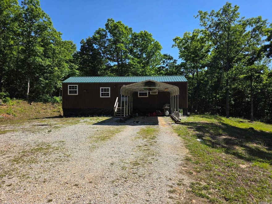 Motivated seller!!! Cabin with acreage in the beautiful Ozarks!  Priced to sell! All the hard work of developing this 18-acre MOL tract has already been done! The spacious cabin is ready to make your own with just over 1000 sq ft, a large 14X40 open concept living/kitchen that could be divided to add a 2nd bedroom, a master with his/her walk-in closet, laundry/pantry room, & a large bathroom. The mostly wooded acreage has gorgeous large native stone ledges, walking & ATV trails, mushrooms, elderberries, muscadines & Little Raccoon Creek is only 10 ft from the back property line! Private septic, 4 frost-free water hydrants, public water, 50amp RV hookup, generator wired, PEX plumbing, foam insulation, large propane tank, nice new chicken coop, & gravel driveway. The cabin is fully functionable & currently owner occupied but the walls, ceiling, & flooring are unfinished. Additional adjoining acreage is available for sale. Call today!