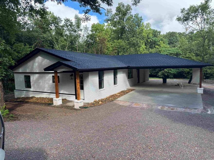 Completely remodeled 3 bedroom, 2 bath home on beautiful Lake Hamilton! This home has been taken down to the bare bones and completely rebuilt with quality updates throughout. Everything has been redone including plumbing, electrical, insulation, HVAC, cabinets, subfloors, and windows — giving you the feel of a brand-new home with the charm of lake living.  Enjoy the spacious outdoor entertaining area featuring a cozy fireplace overlooking the lake, perfect for relaxing evenings or hosting family and friends. Whether you’re looking for a full-time residence, weekend getaway, or investment property, this updated lake home is move-in ready and designed for enjoying life on the water.**Better pictures coming soon**