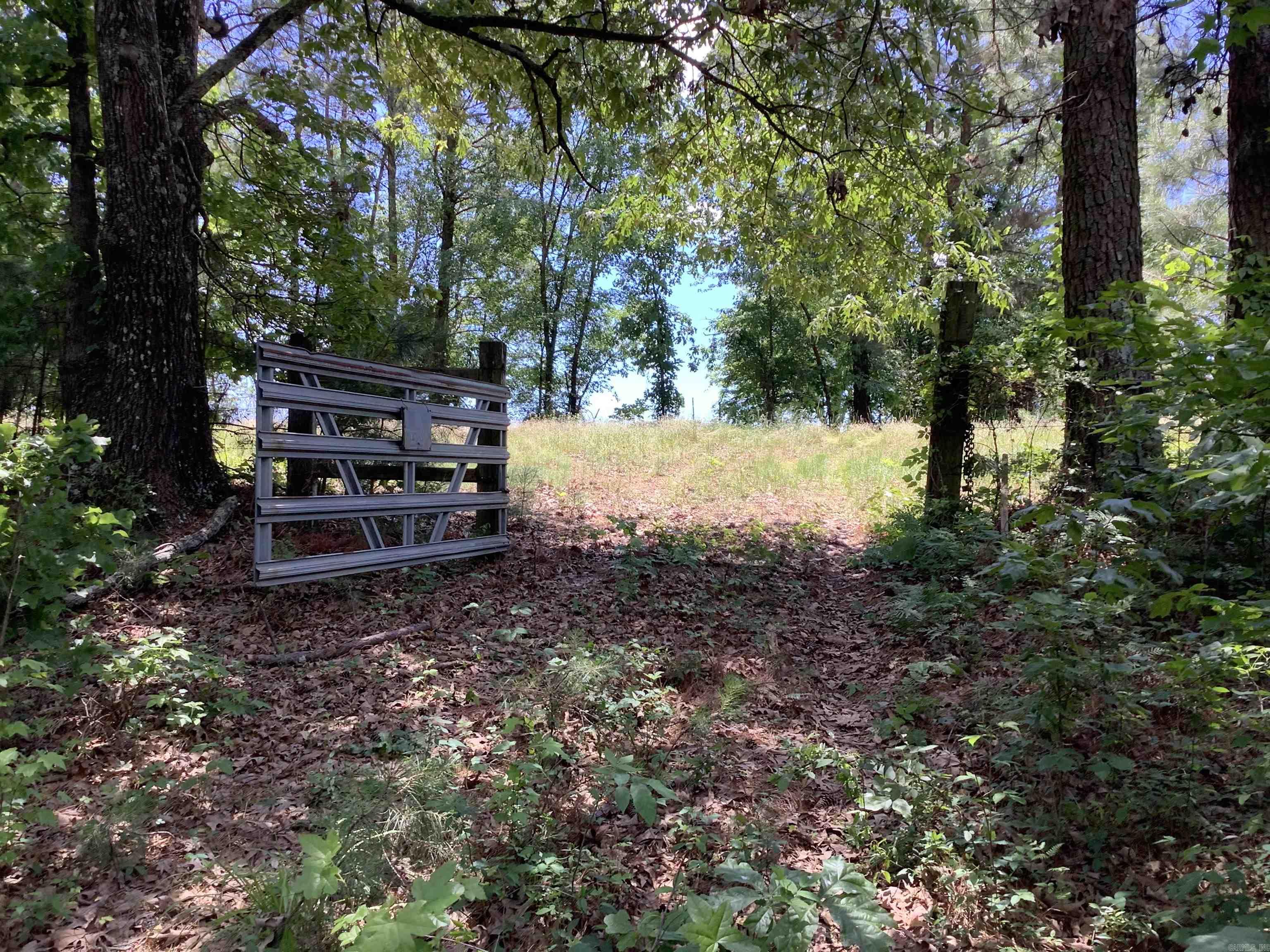 14+/- acres at Interstate 30 & Glen Rose Rd. Outside city limits with no restrictions. Yes mobile homes are allowed. This property has a pond, storage building and 1,830 feet of highway frontage. There is an old structure on the property (at no value) that needs to be removed. Old water well next to structure is not currently used and potential future use is unknown. Water is available at the street according to "Water Users LLC." buyer to verify. Electric at street. Timber was cruised in 1999 with a value of $41,728. Agent is related to seller.