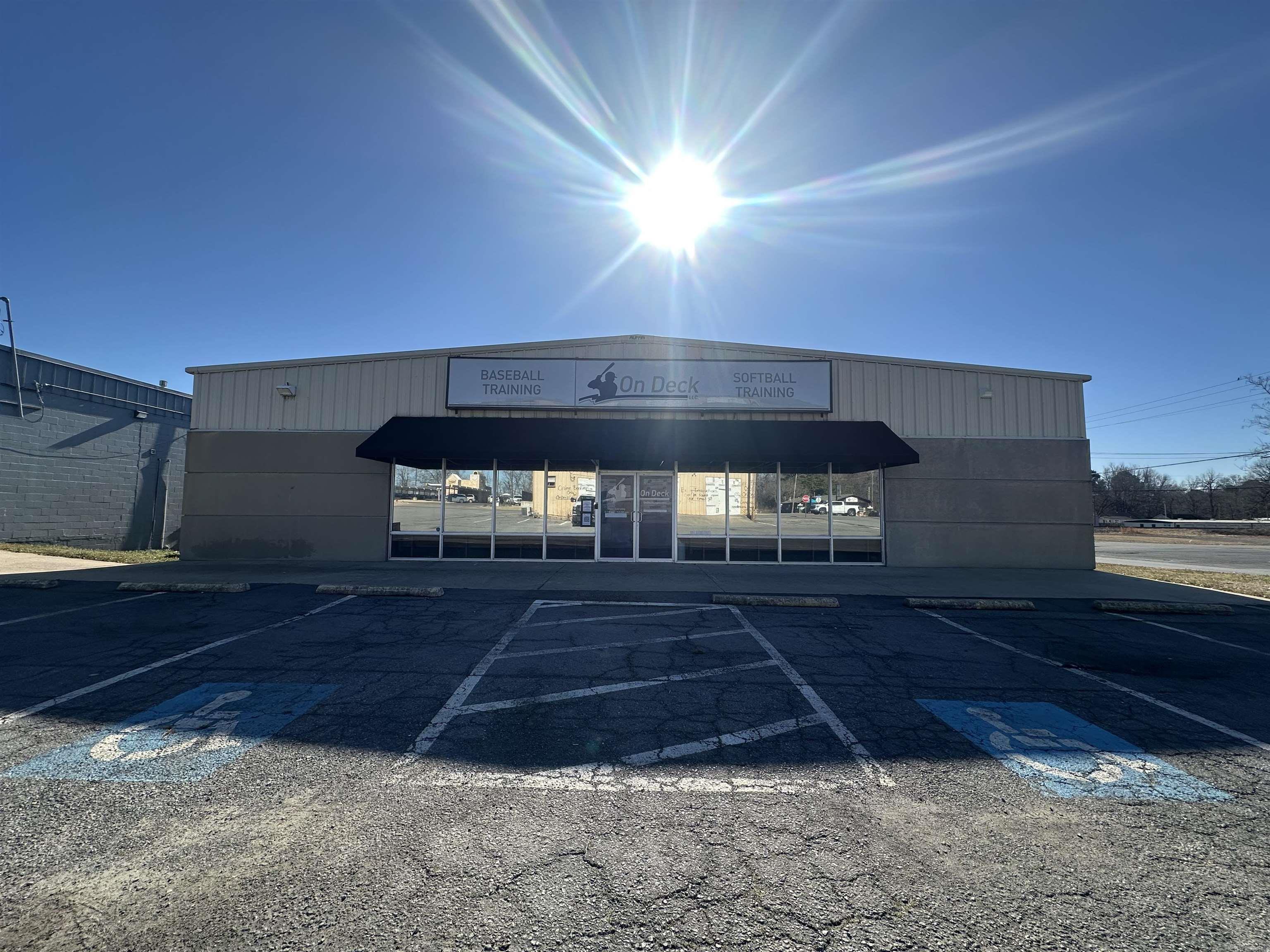 Prime commercial space currently operating as a baseball training facility! Featuring tall ceilings and a full glass frontage with convenient parking out front, this versatile property offers endless possibilities. Inside, the open turf area provides ample space for training, while the back of the building is designed for pitching. Two bathrooms and storage are available for added convenience. Loading doc at back of building and two HVAC units to climate control this large space (one at the back with a distribution sock and an additional at the front of the building). Whether you’re looking to continue its current use or transform it into a business of your choice, this space is ready to meet your needs. Items related to current business negotiable-baseball equipment can be removed prior to closing if desired. **HitTrax equipment does not convey with current listing** Don’t miss out on this incredible opportunity - schedule your showing today!