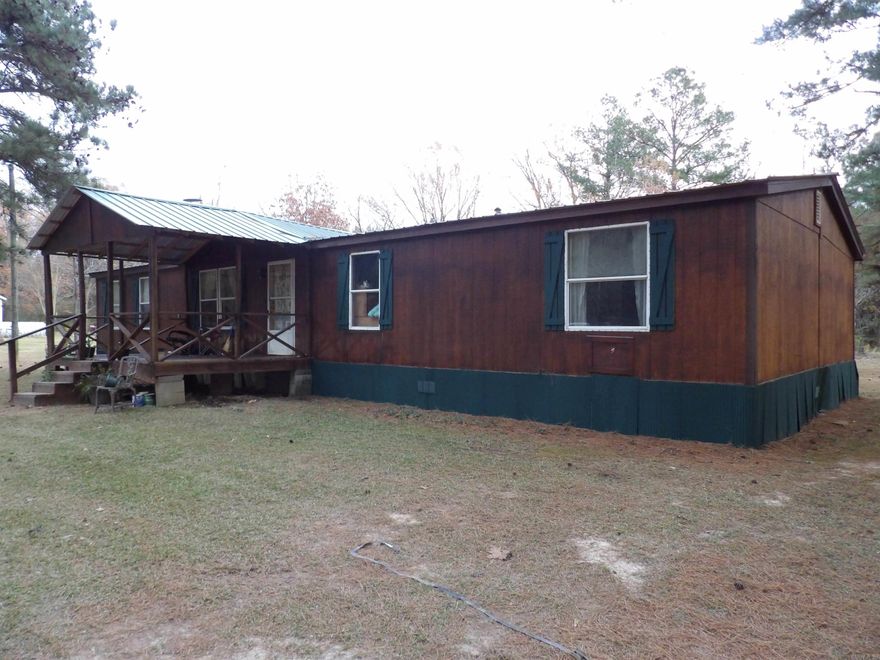 This property is a rare find.  1998 doublewide mobile home sitting on 4.22 acres on a quite country lane, just 5 minutes from town!  Includes a 20 x 30 shop!