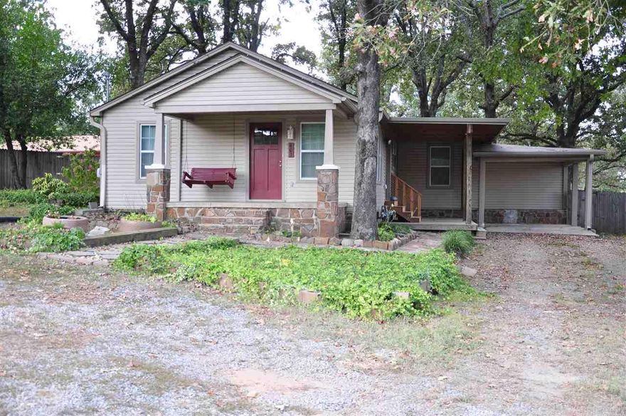 Location! Location! This great home is turn the key and move in. 3 bedrooms, 2 baths, clean as a whistle! Lovely porch with swing. Great patio built in 2018, huge fully fenced backyard with new storage building!  Home sits off the street, circular drive.  Nice covered parking.  New HVAC unit.  New guttering 2017.