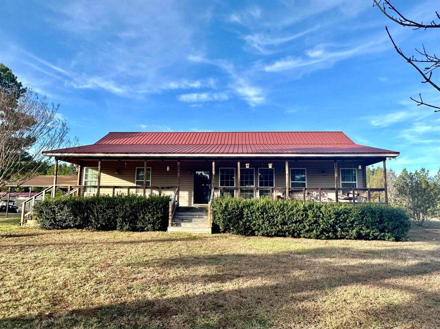 Discover a truly remarkable property with this incredible 3 bedroom, 2 bath home, nestled on 4.75 acres complete with highway frontage. Built in 2012, this home offers stunning features such as a walk-in shower in the primary bath and walk-in closets in the primary bedroom, along with a thoughtfully designed split floor plan for optimal privacy and functionality.  As you step inside, you'll be greeted by a spacious and inviting living area, perfect for entertaining friends and family. The open concept flows seamlessly throughout, connecting the living room, dining area, and kitchen, allowing for effortless socializing and gatherings.