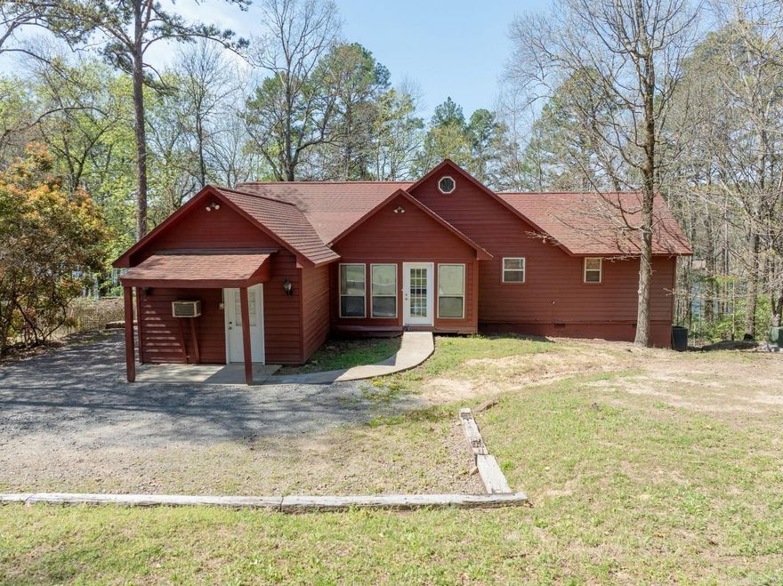 LAKEFRONT HOME on Greers Ferry Lake in very nice condition!!!  This completely furnished homes features a open concept floorplan with vaulted ceilings, exposed beams, wood burring fireplace and a wall of glass overlooking Greers Ferry Lake!  2 large suites and a bunkroom on the main level plus a loft bedroom upstairs.  Hardwood floors, new minisplit in bunkroom, large open deck plus a great covered deck that's perfect for outdoor cooking!  Easy walk to the water, just minutes from Dam Site Marina by car...pull your pontoon up to the shoreline and enjoy!