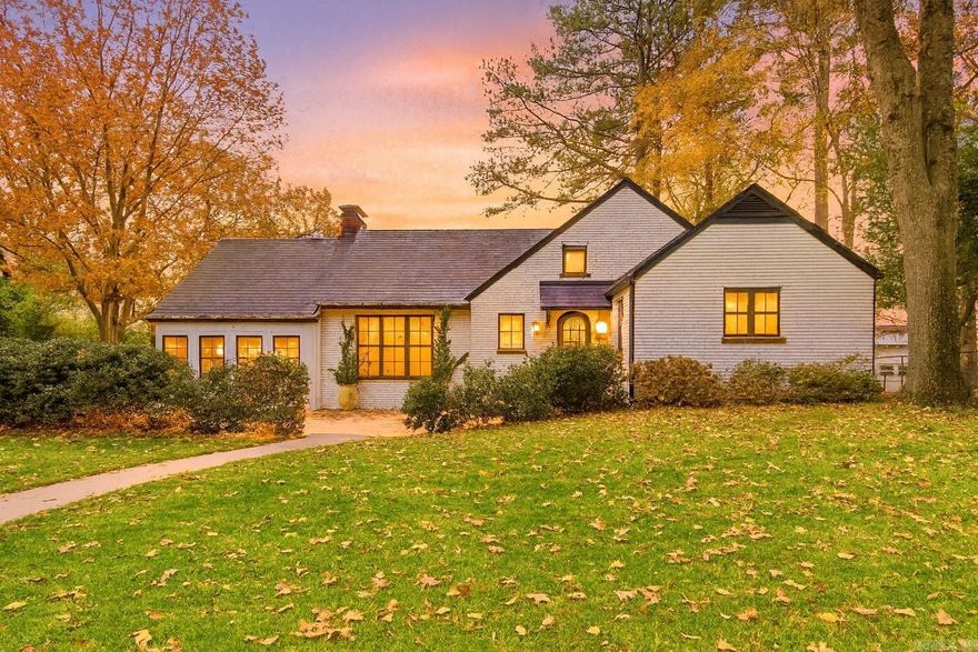 COMPLETELY RENOVATED HISTORIC MATTHEWS-GODT HOME WITH VIEW OF LITTLE ROCK SKYLINE! Updates include all-new plumbing, electrical, windows, Sheetrock, HVAC, paint, lighting, flooring, countertops, appliances, in additon to adding square footage and a bathroom. The inviting foyer opens to a spacious living room with hardwood floors, built-ins, and exposed brick, while the stunning kitchen offers a cathedral ceiling, double oven, large island, window seat, coffee bar, more exposed brick and opens to formal dining room. The private primary suite includes a dressing room/office and a spa-like bath with a custom tile shower. The additional bedrooms are generously sized with large closets and beautiful bathrooms. A bonus room and well-designed laundry/mud area provide extra functionality. The showstopping rooftop deck is perfect for entertaining or relaxing, complete with wooded views and the downtown skyline—offering the best of both nature and city living.  Next door is a community garden, for added privacy. A park like backyard and 2-car carport with workshop area completes this exceptional home.