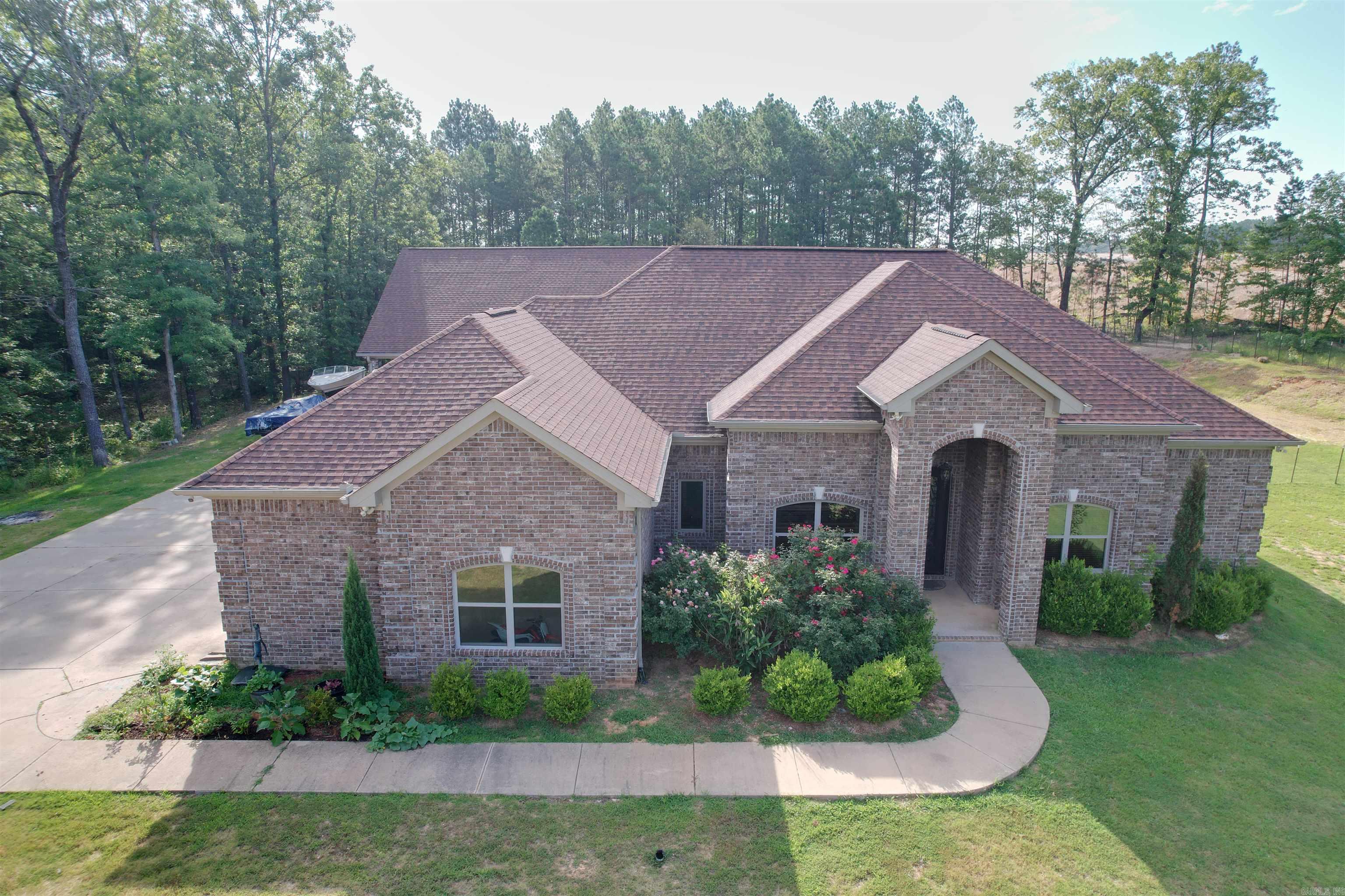 Don't miss this amazing home on 1.88 acres with plenty of privacy. 4 bedroom 2 1/2 bath, walk-in closets, granite countertops, title flooring, stainless steel appliances. Tornado shelter build in master closet. Huge master bathroom. 2 car garage with epoxy flooring. Enjoy entertaining with the outdoor kitchen. Home offers an awesome separate living quarters with 4-bedroom 2 full bath, 2 car garage and large bonus (game) room. Minutes away from Outlets of Little Rock. Come grow in this beautiful home.