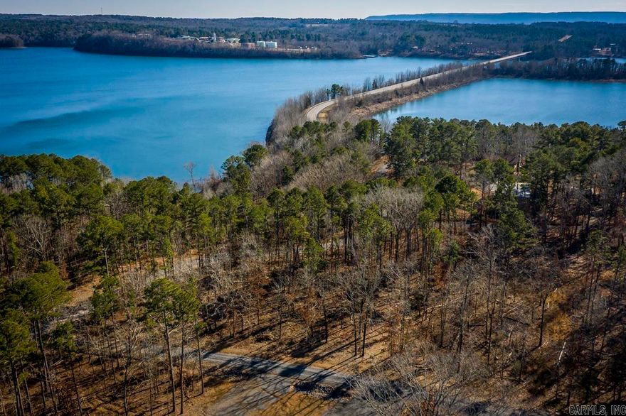 Build your dream LAKE HOME and WALK TO THE LAKE. This unrestricted acreage has the potential for a lovely detached home with room to put a shop, a garden, a boat house etc. or could be purchased in individual tracks. Watch the Sun come up in the morning and the glow of the moonlight sparkle cross the LAKE at night.  A great way to enjoy the wonders of Greers Ferry Lake. (Agents see Remarks)