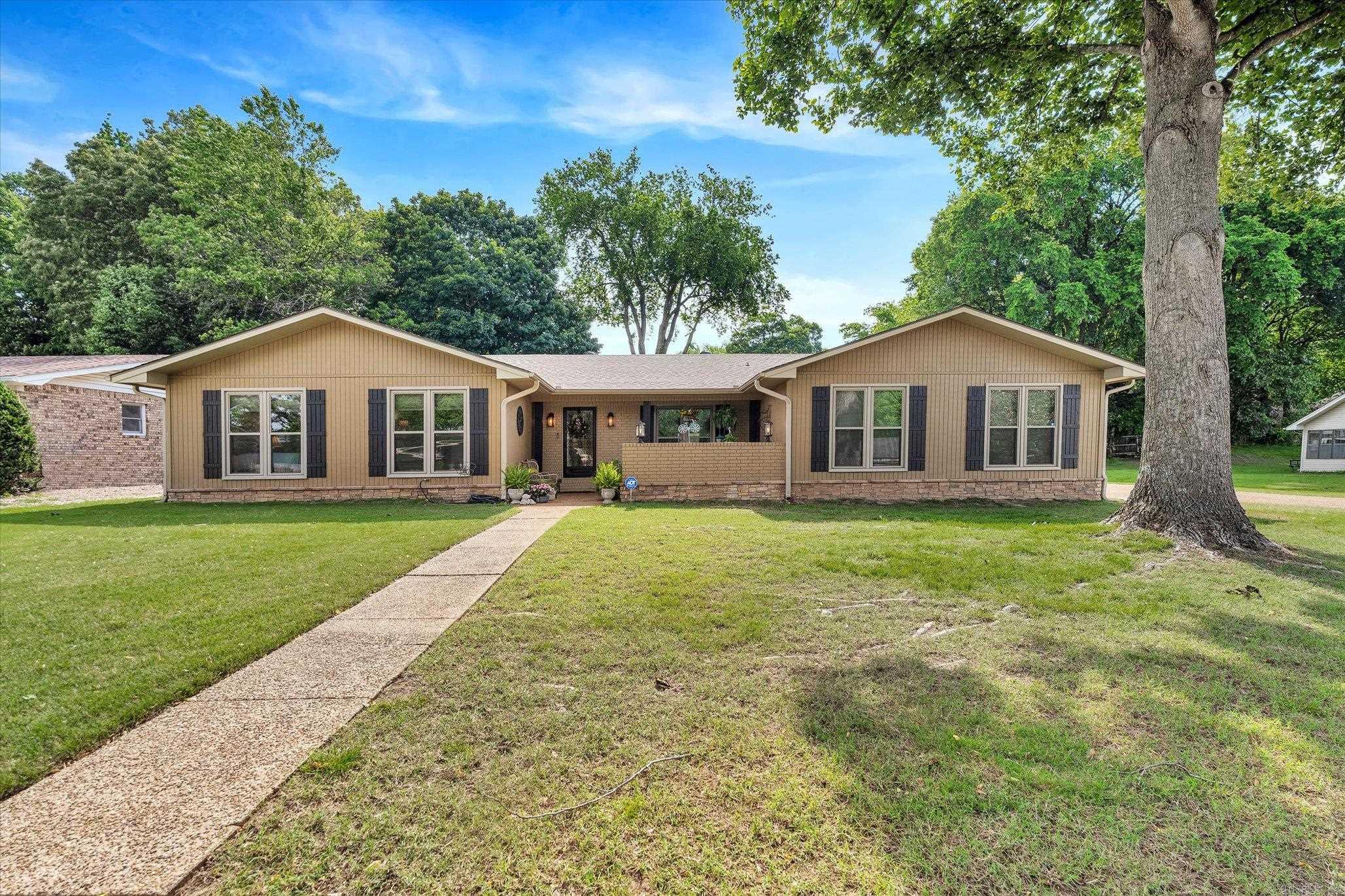 Welcome to 2806 Martinbrook Drive, a well-maintained and move-in ready ranch-style home nestled in the desirable Marlo Acres Subdivision within the Jonesboro School District. This spacious 4-bedroom, 2.5-bath home offers two large living areas, perfect for comfortable family living or entertaining guests. The second living room features a cozy fireplace with gas logs, ideal for relaxing evenings at home. The home boasts a large, fenced backyard complete with an insulated storage building great for extra storage. Recent updates include a brand-new roof and electrical panel (April 2025), providing peace of mind for years to come. Additional highlights include a functional layout, abundant natural light, and a seller-provided one-year home warranty for added confidence. There is also a free-standing storm shelter in the newly painted garage. Don't miss your opportunity to own this charming home in a quiet, established neighborhood. Schedule your showing today!