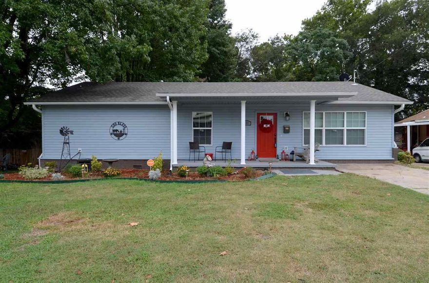 Wow factor!  The original home was destroyed by fire--this one was newly constructed in Sept., 2013.   You will love the open concept kitchen, spacious bedrooms, and closets galore!  Beautiful high end laminate flooring has look of hand-scraped hardwoods.  Granite counter tops in kitchen and SS appliances.  Top it all off with an extra large lot and you will want to call this home.  Call today for a personal viewing.