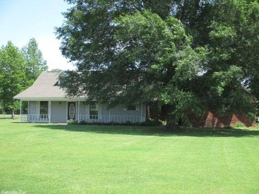 Wonderful 3 BD/2 BA home on just over 5 acres. 2 RV hookups, hot and cold water outside and at detached workshop/garage. Beautiful setting, small pond in back corner of property.