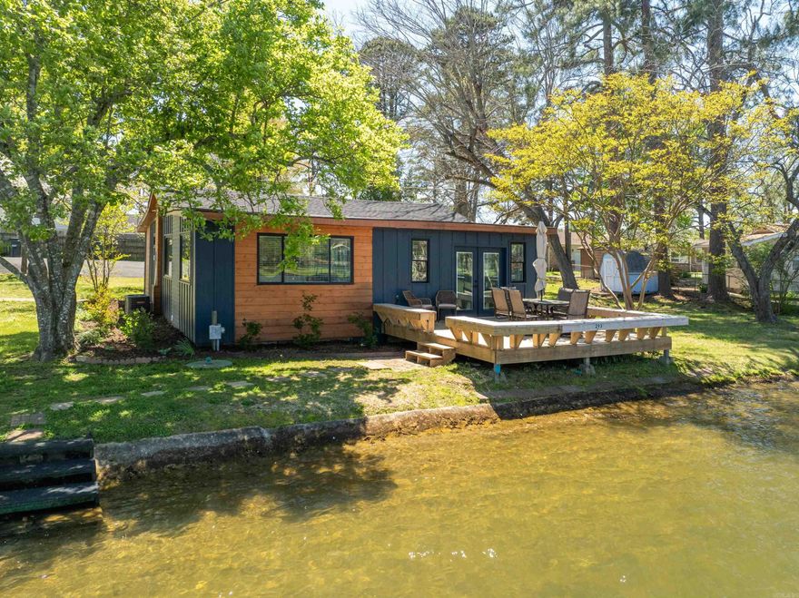 Check out this recently updated 2 bedroom 2 bath cottage on the waters edge of Lake Hamilton. The Lake views from the back deck are amazing. This comes completely furnished and ready to go for the summer! It is currently being used as a nightly rental. The lake frontage is 100' and qualifies for a 2 stall boat dock. This lot is plenty big if you want to add on to the existing home, and is located in Lakeside School District. Make an appointment to see this affordable lake home today.