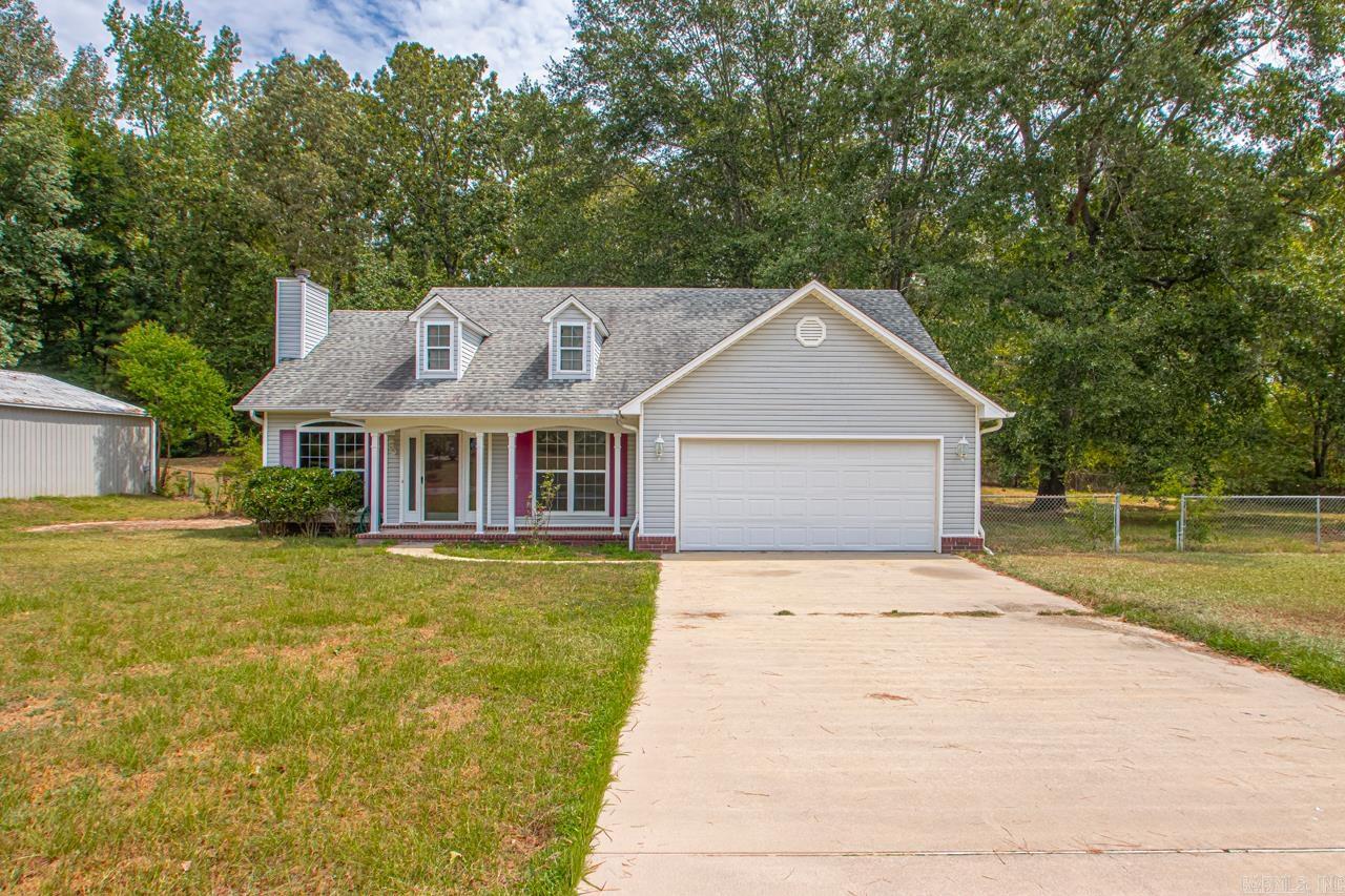 Look at this charming property! 4 bedrooms and 2 full bathrooms. This home features new paint throughout, new LVP flooring, and new carpet in two bedrooms. The kitchen boasts nice oak cabinets, a pantry, and a large laundry room. The living room is mostly open to the kitchen and dining area, with a wood burning fireplace. French doors lead out to a covered back porch, perfect for grilling. The bedrooms are located down the hall, with 4 full bedrooms featuring closets. The primary bedroom and bathroom are spacious, including a large walk-in closet. A portion of the garage was converted into an extra bedroom and storage closet, with remaining storage space in the garage. The shop is 30x30, with one overhead door and one regular access door. The roof was replaced in 2017. The fully fenced backyard features a tornado shelter. This neighborhood is ideal for families, being kid and pet-friendly.