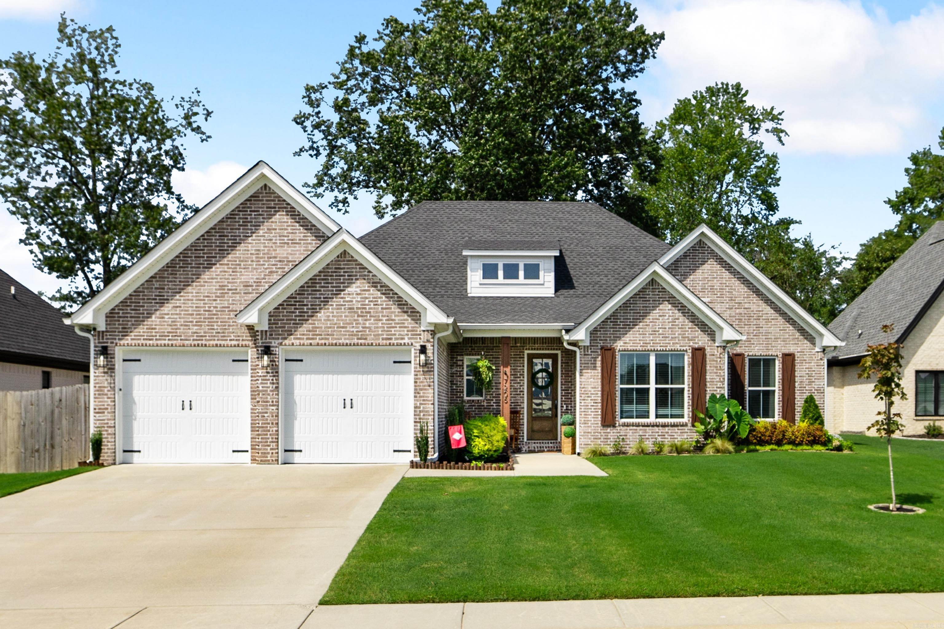 Less than 3 years old, this gem in The Woods of Hurricane Lake Estates was designed with style, comfort, and space in mind. From the inviting front porch to the tall ceilings, with exposed beams and stone fireplace, every room feels open and welcoming. The open floor plan showcases spacious rooms filled with custom finishes, updated light fixtures, and a chefās kitchen, complete with floor to ceiling cabinets, beautiful quartz counters, an oversized island, GE Profile appliances, and a large walk-in pantry. The beautiful wood floors continue into the primary suite, which has striking wood beams and includes a soaking tub, extensive walk-in shower with rain showerhead, double vanities, and an impressive walk-in closet with attached laundry access.Outside, enjoy wooded views in a fully fenced yard, a covered patio, extended 12X25 entertaining pad, and built in dog door. Beautifully landscaped and free from HOA dues, this home truly has it all! Centrally located near Little Rock & I-30!!!