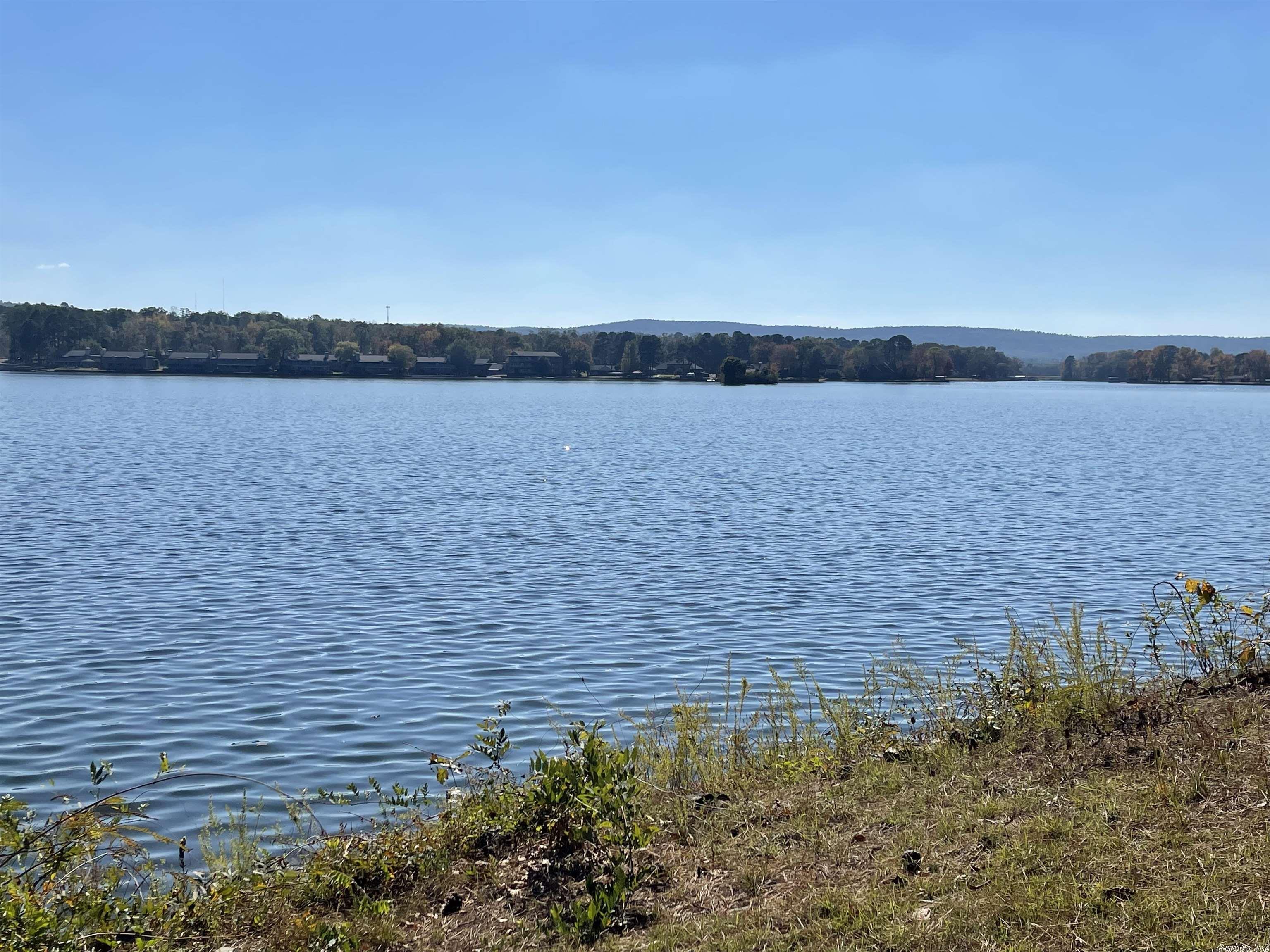 One of the most beautiful and expansive views on Lake Hamilton with 145' of lake frontage. Build your dream home on this amazing part of the lake within walking distance of the Garvan Woodland Gardens. New grinder pump installed on property, don't miss this opportunity!
