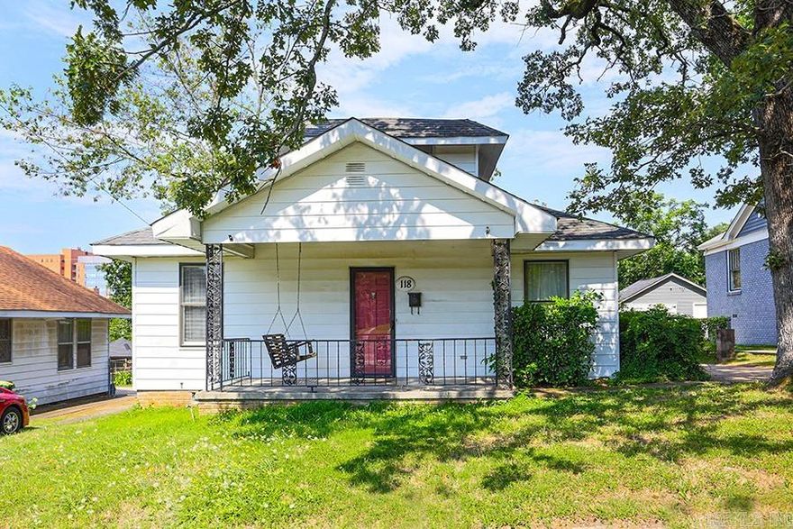 Amazing opportunity in Hillcrest!  Located adjacent to UAMS, this could easily be a rental or an investor/contractor could renovate.  Beautiful hardwood floors with a living room and cozy brick den.  Three bedrooms and two bathrooms down, and one bedroom and a half-bath up.   Kitchen adjoins a quaint breakfast nook.  Laundry room off the den.  Tankless hot water heater.  Generous bedrooms with plenty of space.  Bath features original tile.  Lots of storage in the kitchen.  Plenty of closet space!  Nice backyard with a brick fence.  Property is being sold AS-IS  Come see today! Agents - see remarks.