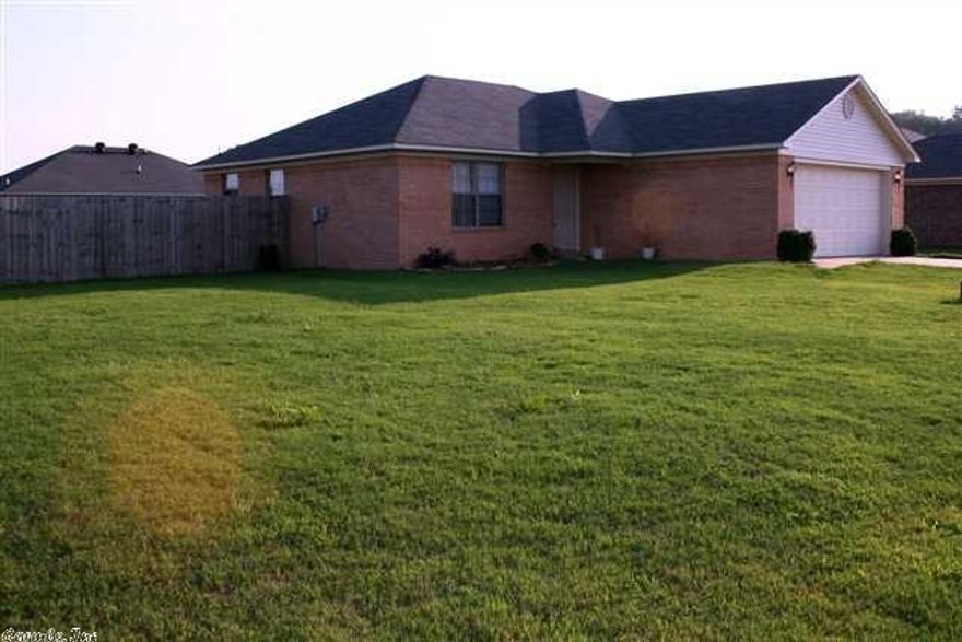 Looking for room to play outdoor sports? This home is sitting on a huge corner lot and it just may be the answer. Great for first time buyer or investor. This home has an Open floor plan with great looking wood laminate floors in the living area.Tile in all the wet areas. NEW CARPET IN ALL CARPETED AREAS! The neutral color palette invites you to use your imagination to use your favorite colors in your decor. Refrigerator conveys!  Great location for convenience AND It qualifies for a Rural Development loan.