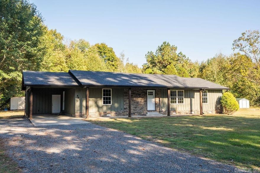 Beautifully renovated and move-in ready, this 3-bedroom, 2-bath home showcases meticulous craftsmanship and modern finishes throughout. Enjoy a spacious open layout featuring a large living room, dining area, and a gorgeous kitchen with granite countertops, new stainless steel appliances, all new cabinets in a gorgeous neutral shade with soft-close doors and drawers, and a breakfast bar. The split floor plan offers a private primary suite with dual closets and a walk-in shower. Everything has been updated—new roof, plumbing, electrical, and LVP flooring to name a few. A versatile bonus room provides extra space for a sunroom, office, or game room. Step out onto the covered back porch with ceiling fan and enjoy your private back yard! Sitting on a beautiful half-acre lot, this property also includes an attached carport with storage, a storage shed, and easy walk-in access to the Little Red River just across the road. Don't miss out on this home, practically a new build!