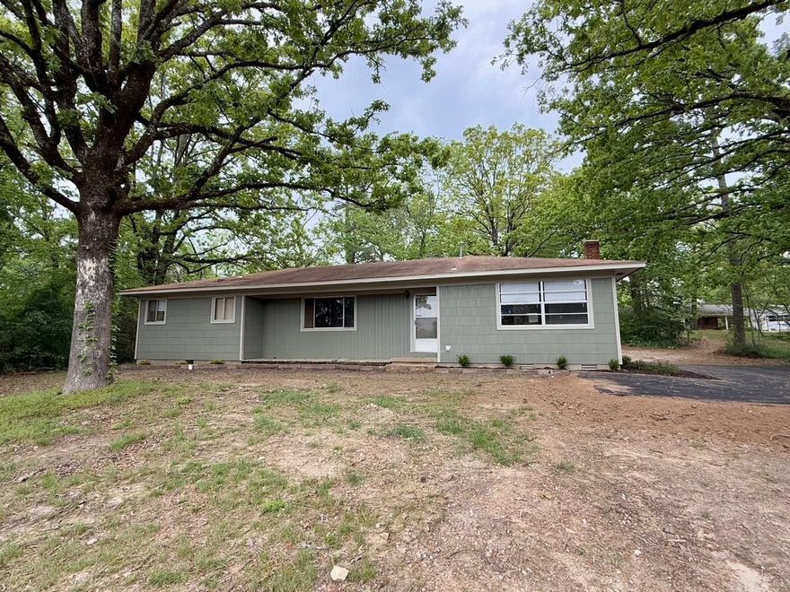Welcome to this charming 4B/2B home conveniently located inside Hot Springs city limits. As you step inside, you will notice the fully renovated home. New luxury vinyl plank flooring, freshly painted walls, new landscaping, all of this providing a fresh new and modern feel to this 1950's home. Additional features include a new asphalt driveway and coming soon is a privacy fence in the backyard. This is an affordable opportunity for first-time homebuyers or investors. Call today!