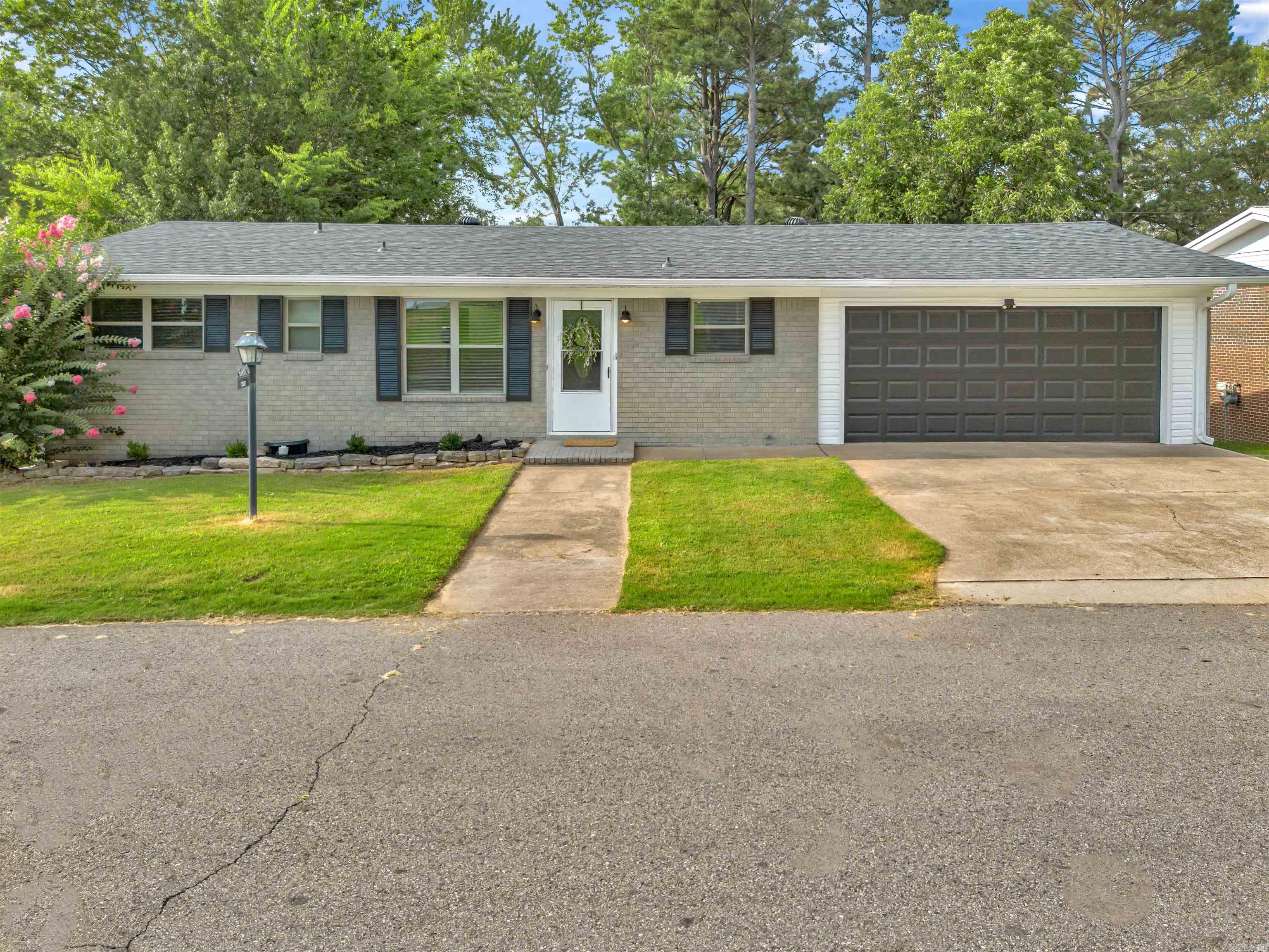 Welcome to this beautifully updated 3-bedroom 2-bath home located in an established neighborhood. This home boasts a range of modern updates while maintaining classic charm. Enjoy the peace of mind with one year HVAC system and a roof that is less than six months old. Inside you will find hardwood floors, complimented by stylish tile in high traffic areas. Spacious layout features two generous living spaces. Freshly painted interior gives the home gives the home a bright, inviting feel, while updated light fixtures add a contemporary touch. The fenced backyard offers a private space to unwind, and there is an outdoor storage building. Don't miss your chance on this move in ready home!