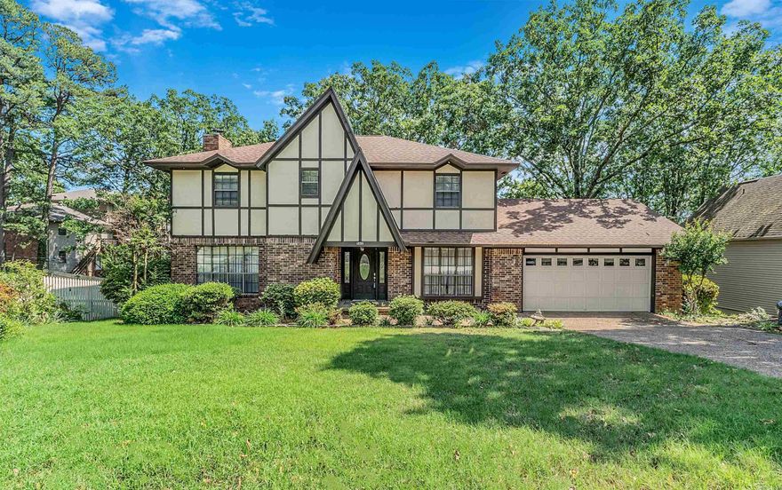 Charming Tudor-style home in the desirable Overbrook Subdivision! This 4 Bedroom, 2.5 Bath is a blank canvas, awaiting its NEW owner! The spacious Living Room features a beautiful fireplace with walk out to a lush, fully fenced backyard! Kitchen has modern updates: flooring (brand NEW), cabinetry, counters and backsplash! Upstairs includes 4 large bedrooms, hall bath with double sinks and generous storage! Primary Bedroom has on suite with double sinks, and updated walk-in shower. NEW roof (2022) & NEW hot water heater (2024)! Plus, access to the neighborhood pool; playground; pickle, tennis and basketball courts & more!!! Schedule a showing today!