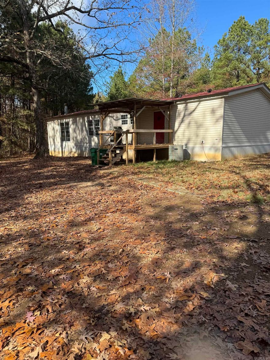 Check out this 3 bedroom 2 bath home on a beautiful wooded 3 acre lot. This home features two living spaces, split floor plan, gas fireplace and new flooring and paint in the master. You can also enjoy a large kitchen and plenty of storage. As well as double carport outside. This is the one you've been looking for!