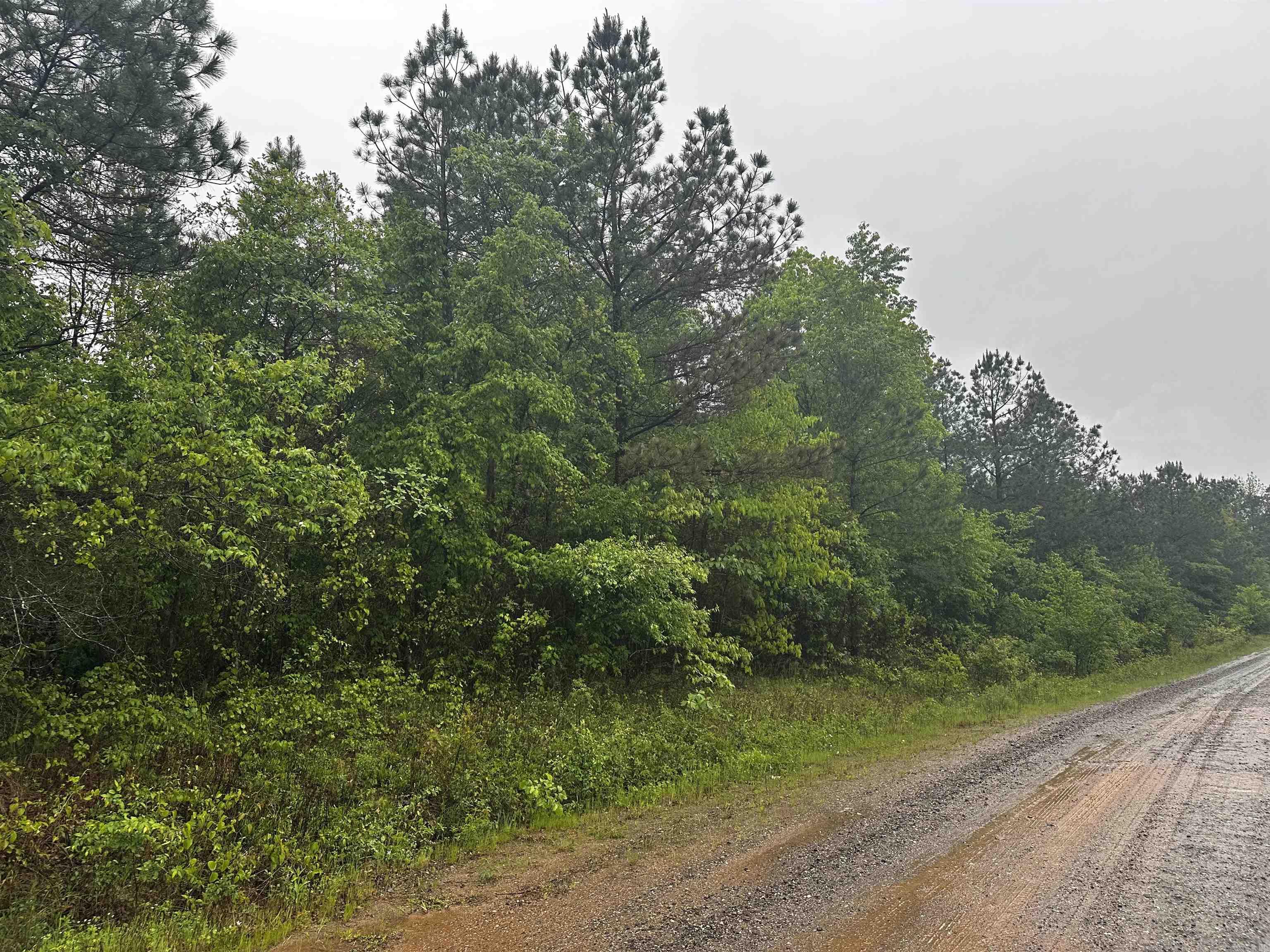 3 acres in the beautiful countryside. Fairly close to Lake Hamilton but still with seclusion. Property is aprox 7 miles from Lake Hamilton school. Most of the road is paved to property... the last bit is gravel.
