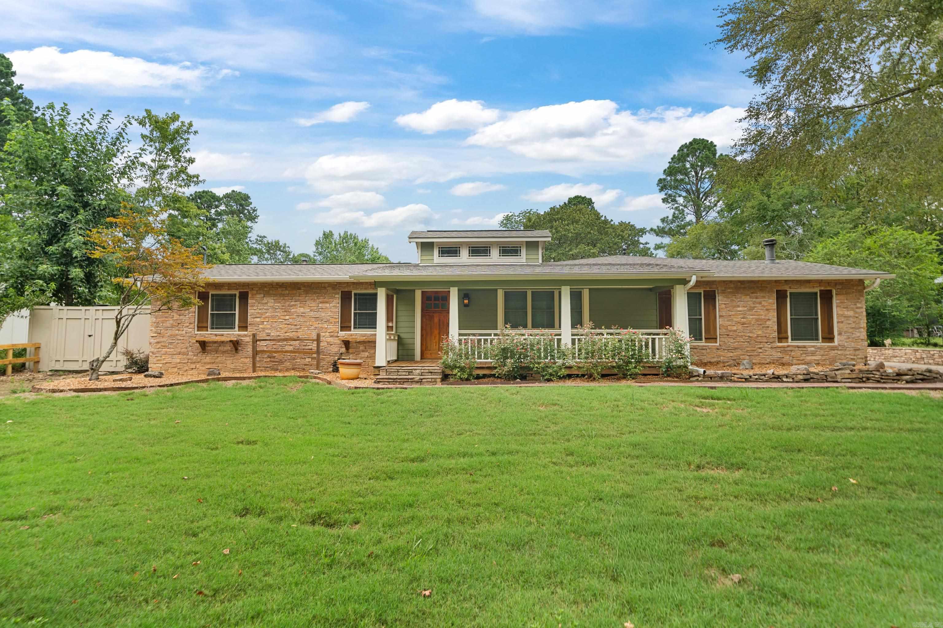 You will fall in love with this beautifully remodeled Craftsman-style home! The open concept layout allows for seamless flow between the indoor and outdoor living spaces! You will appreciate features like the quartz countertops, luxurious LVP flooring, island kitchen, built-ins and custom finishes throughout! Once outside the outdoor retreat will make the perfect place to entertain with counter/grilling area, outdoor fireplace (including 32x11 covered, and 32x17 carport). Not included in the square footage is the bunkhouse that is heated and cooled and has its own garage. Use this flex space as additional living space, a home gym or office, craft room, play space-the sky is the limit!