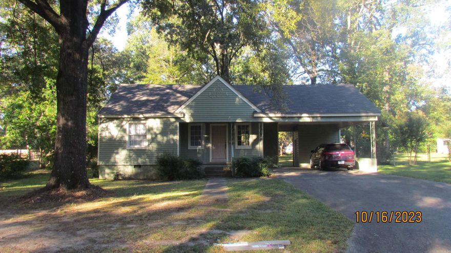 Beautiful Curb appeal, this home has been totally remodeled.  It features a formal living room, formal dining room, kitchen, laundry room, Master Bedroom with walk-in closet, and a new bathroom with beautiful walk-in shower, two bedrooms with a remodeled hall bathroom.  New carpet in the living room and bedrooms, and new flooring in dining room, kitchen, laundry room, and bathrooms.  New lighting also added to some rooms,  There is also a storage room under the double carport and a large yard.  This is one you must see.